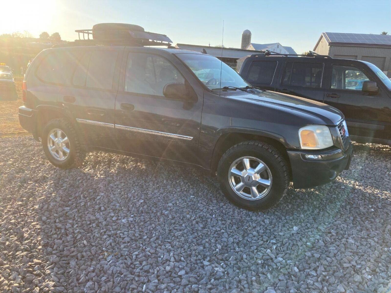 2007 Black GMC Envoy (1GKDT13S172) with an 4.2L I6 4.2L I6 engine, located at 4845 Woodbury Pike, Roaring Springs, PA, (814) 317-5008, (814) 317-5008, 40.250935, -78.366959 - 2007 GMC Envoy, 220k, automatic, 4x4, new tires, new inspection. Southern vehicle! Beautiful undercarriage! Rust free frame! Body is in excellent condition! Runs and drives 100%! If interested, please call 814-317-5008 or 814-497-4383. - Photo #1