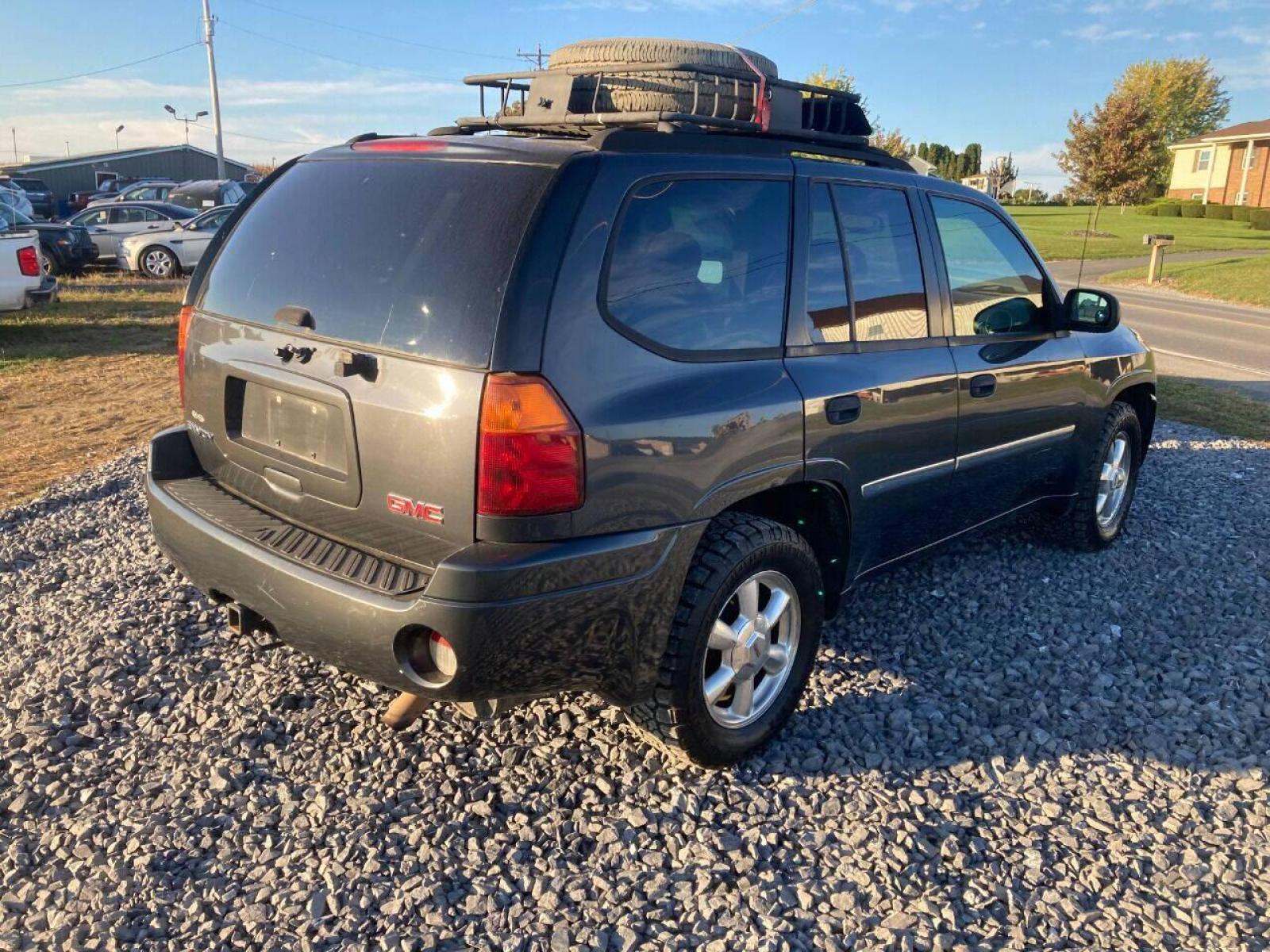 2007 Black GMC Envoy (1GKDT13S172) with an 4.2L I6 4.2L I6 engine, located at 4845 Woodbury Pike, Roaring Springs, PA, (814) 317-5008, (814) 317-5008, 40.250935, -78.366959 - 2007 GMC Envoy, 220k, automatic, 4x4, new tires, new inspection. Southern vehicle! Beautiful undercarriage! Rust free frame! Body is in excellent condition! Runs and drives 100%! If interested, please call 814-317-5008 or 814-497-4383. - Photo #2