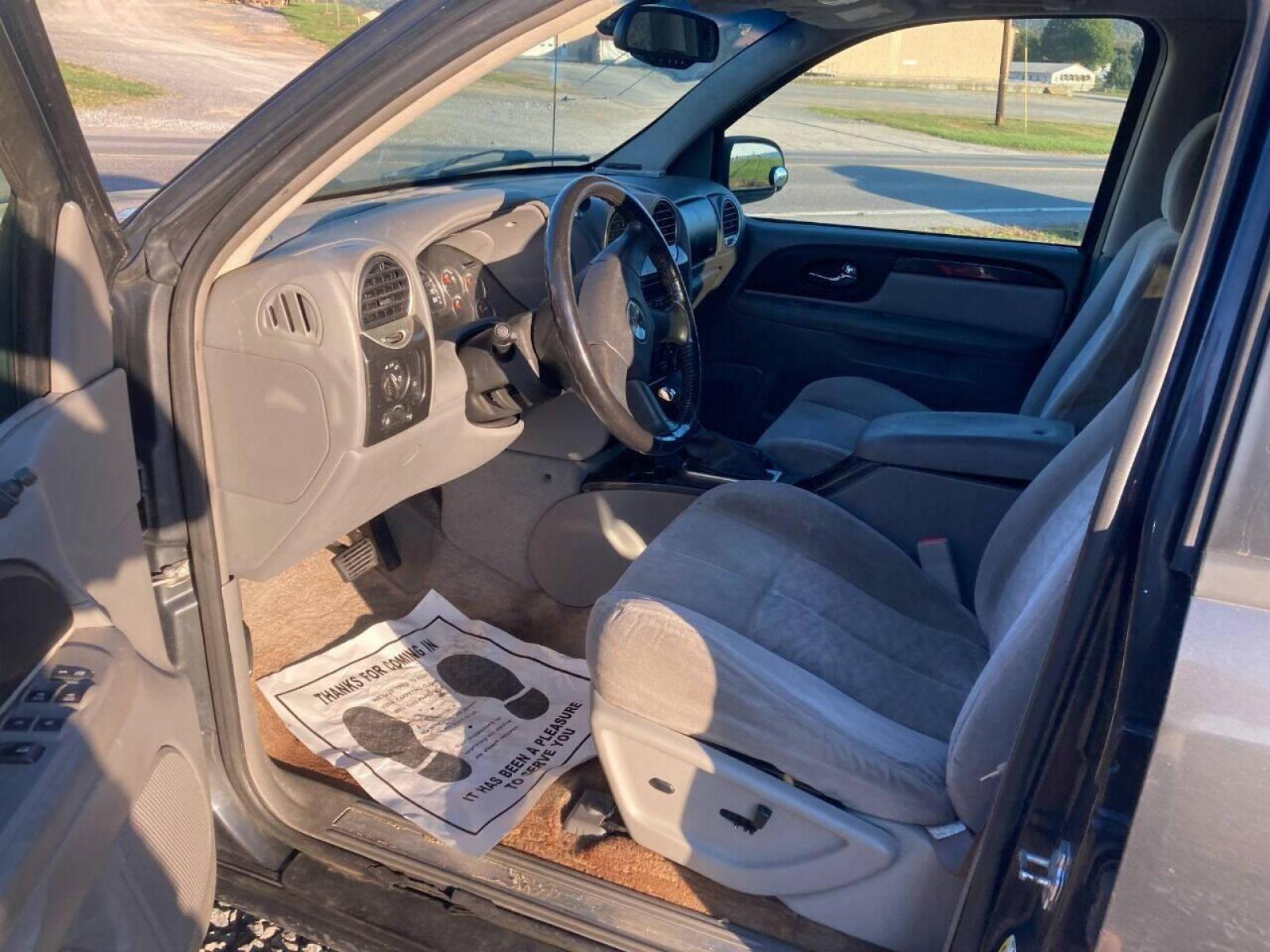 2007 Black GMC Envoy (1GKDT13S172) with an 4.2L I6 4.2L I6 engine, located at 4845 Woodbury Pike, Roaring Springs, PA, (814) 317-5008, (814) 317-5008, 40.250935, -78.366959 - 2007 GMC Envoy, 220k, automatic, 4x4, new tires, new inspection. Southern vehicle! Beautiful undercarriage! Rust free frame! Body is in excellent condition! Runs and drives 100%! If interested, please call 814-317-5008 or 814-497-4383. - Photo #5