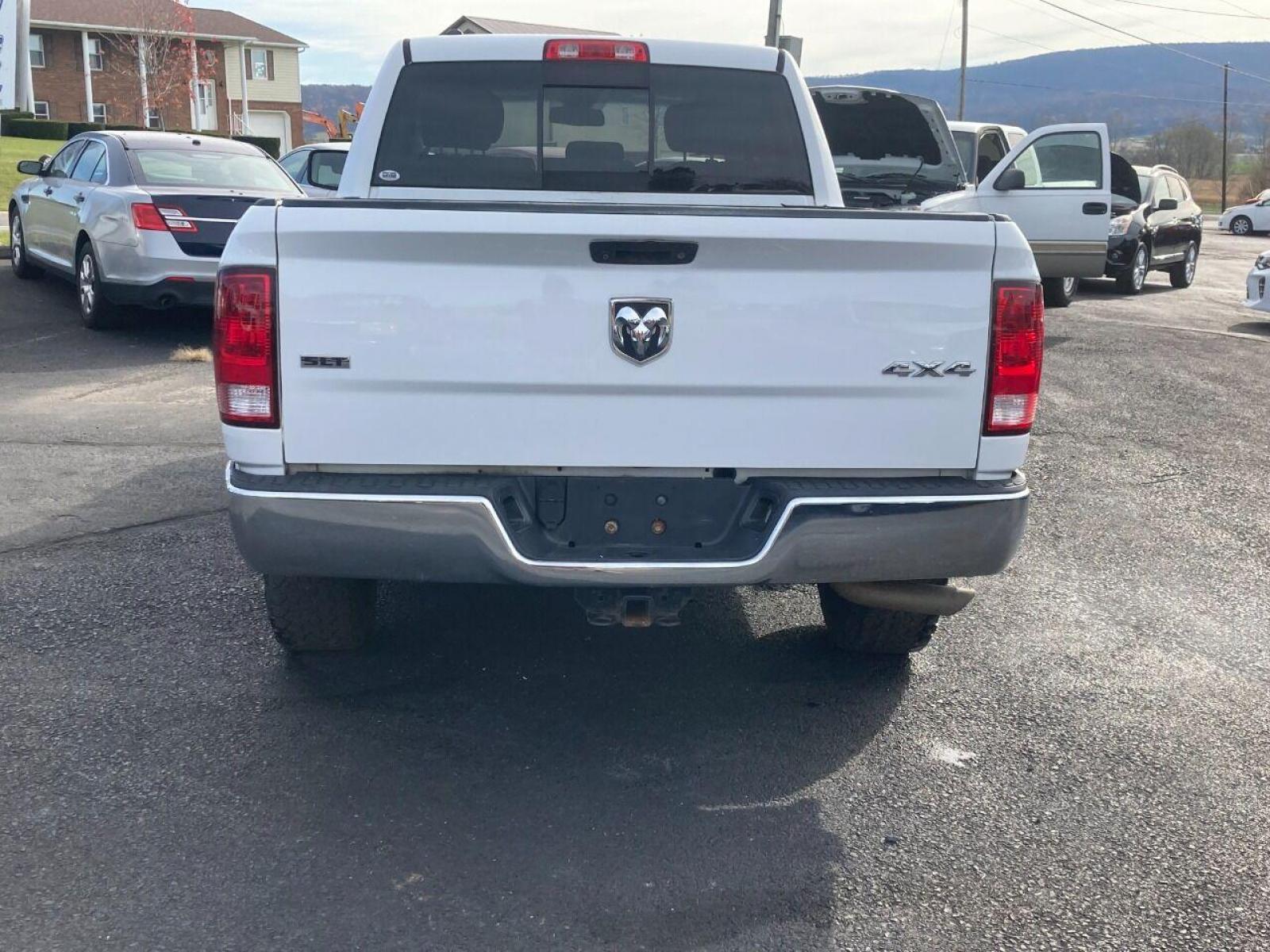 2014 White RAM 1500 (1C6RR7GT8ES) with an 5.7L V8 5.7L V8 engine, located at 4845 Woodbury Pike, Roaring Springs, PA, (814) 317-5008, (814) 317-5008, 40.250935, -78.366959 - 2014 Dodge Ram 1500, Quad cab, SLT, 5.7 Hemi, 4x4, 189k, aluminum wheels/running boards, rear back up camera, factory trailer brake, trip trailer package, power seat, flip up center console, new inspection. Truck is serviced and ready to go! Southern truck! Well maintained! Will come with a warr - Photo #4
