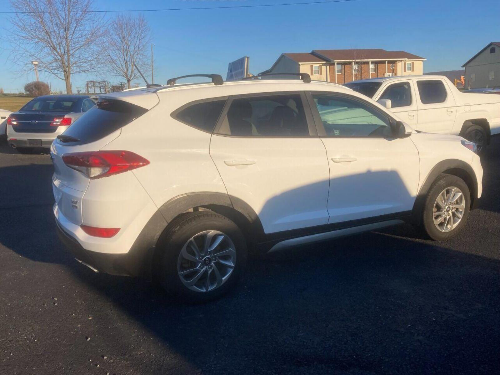 2017 White Hyundai Tucson (KM8J3CA21HU) with an 1.6L I4 Turbocharger 1.6L I4 engine, located at 4845 Woodbury Pike, Roaring Springs, PA, (814) 317-5008, (814) 317-5008, 40.250935, -78.366959 - 2017 Hyundai Tucson, Eco, AWD, 1.6L, automatic, power windows/locks, cruise/tilt, air, new tires, new inspection. Southern vehicle! Excellent condition! Super clean must see condition! Will come with a warranty with the option to upgrade. If interested, please call 814-317-5008. - Photo #2
