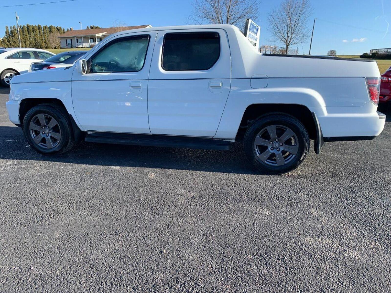 2014 White Honda Ridgeline (5FPYK1F54EB) with an 3.5L V6 3.5L V6 engine, located at 4845 Woodbury Pike, Roaring Springs, PA, (814) 317-5008, (814) 317-5008, 40.250935, -78.366959 - 2014 Honda Ridgeline, automatic, V6, 64k, 4x4, leather, roof, power windows/locks, cruise/tilt wheel, air conditioning, like new tires, new inspection and more. Rust free! Must see condition! Vehicle is only being sold cheaper due to having a Reconstructed title. Truck had damage to lower contr - Photo #0
