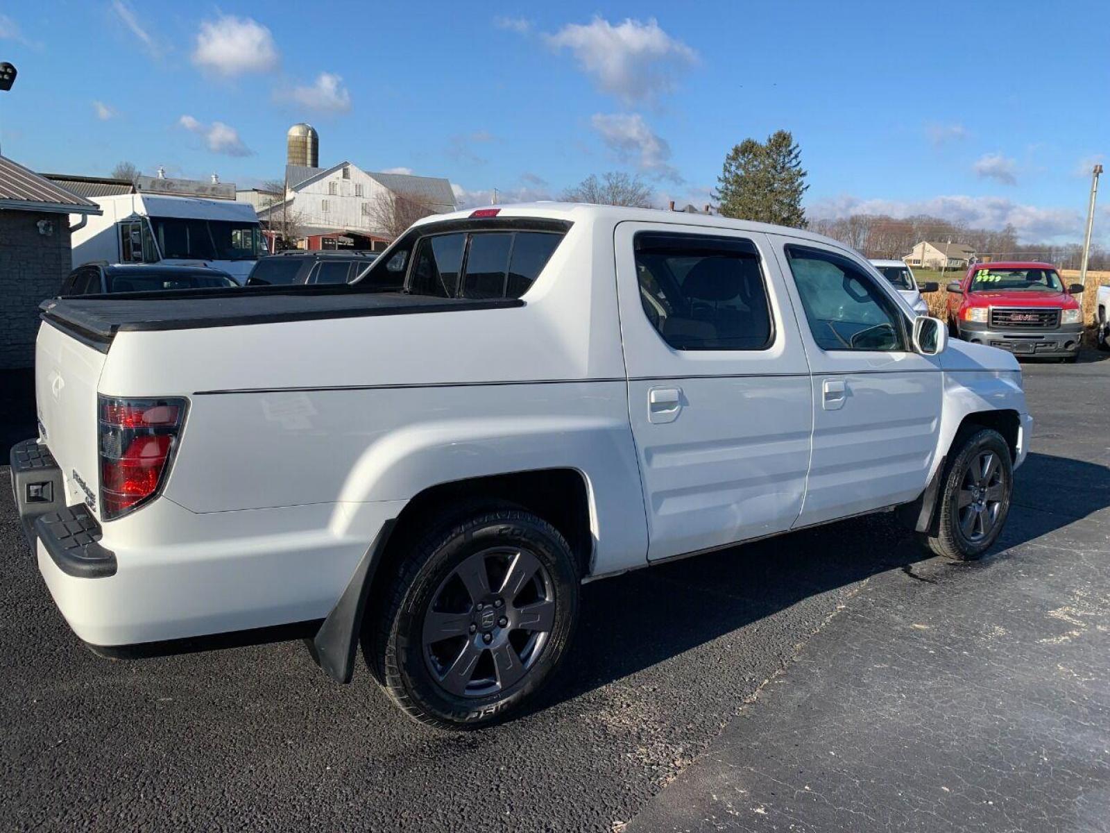 2014 White Honda Ridgeline (5FPYK1F54EB) with an 3.5L V6 3.5L V6 engine, located at 4845 Woodbury Pike, Roaring Springs, PA, (814) 317-5008, (814) 317-5008, 40.250935, -78.366959 - 2014 Honda Ridgeline, automatic, V6, 64k, 4x4, leather, roof, power windows/locks, cruise/tilt wheel, air conditioning, like new tires, new inspection and more. Rust free! Must see condition! Vehicle is only being sold cheaper due to having a Reconstructed title. Truck had damage to lower contr - Photo #1