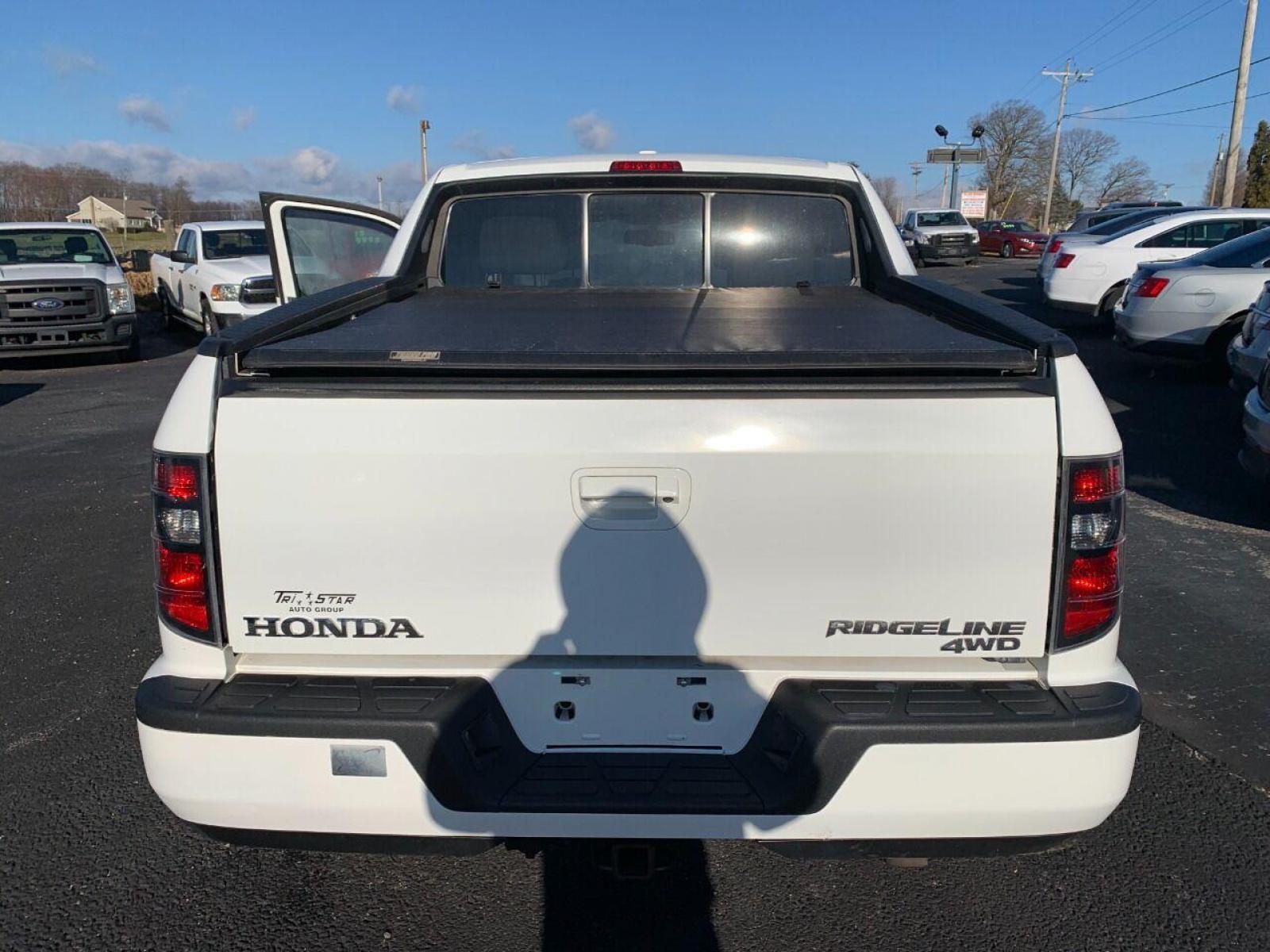 2014 White Honda Ridgeline (5FPYK1F54EB) with an 3.5L V6 3.5L V6 engine, located at 4845 Woodbury Pike, Roaring Springs, PA, (814) 317-5008, (814) 317-5008, 40.250935, -78.366959 - 2014 Honda Ridgeline, automatic, V6, 64k, 4x4, leather, roof, power windows/locks, cruise/tilt wheel, air conditioning, like new tires, new inspection and more. Rust free! Must see condition! Vehicle is only being sold cheaper due to having a Reconstructed title. Truck had damage to lower contr - Photo #3