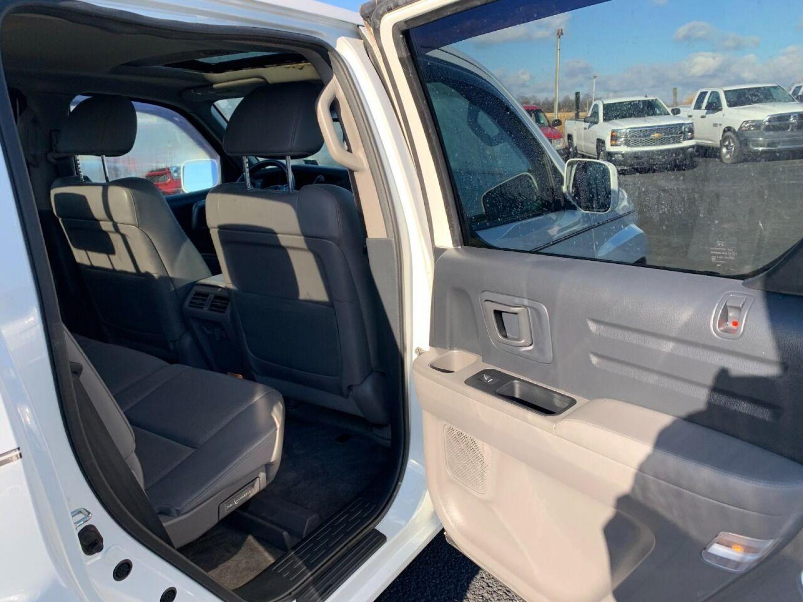 2014 White Honda Ridgeline (5FPYK1F54EB) with an 3.5L V6 3.5L V6 engine, located at 4845 Woodbury Pike, Roaring Springs, PA, (814) 317-5008, (814) 317-5008, 40.250935, -78.366959 - 2014 Honda Ridgeline, automatic, V6, 64k, 4x4, leather, roof, power windows/locks, cruise/tilt wheel, air conditioning, like new tires, new inspection and more. Rust free! Must see condition! Vehicle is only being sold cheaper due to having a Reconstructed title. Truck had damage to lower contr - Photo #6