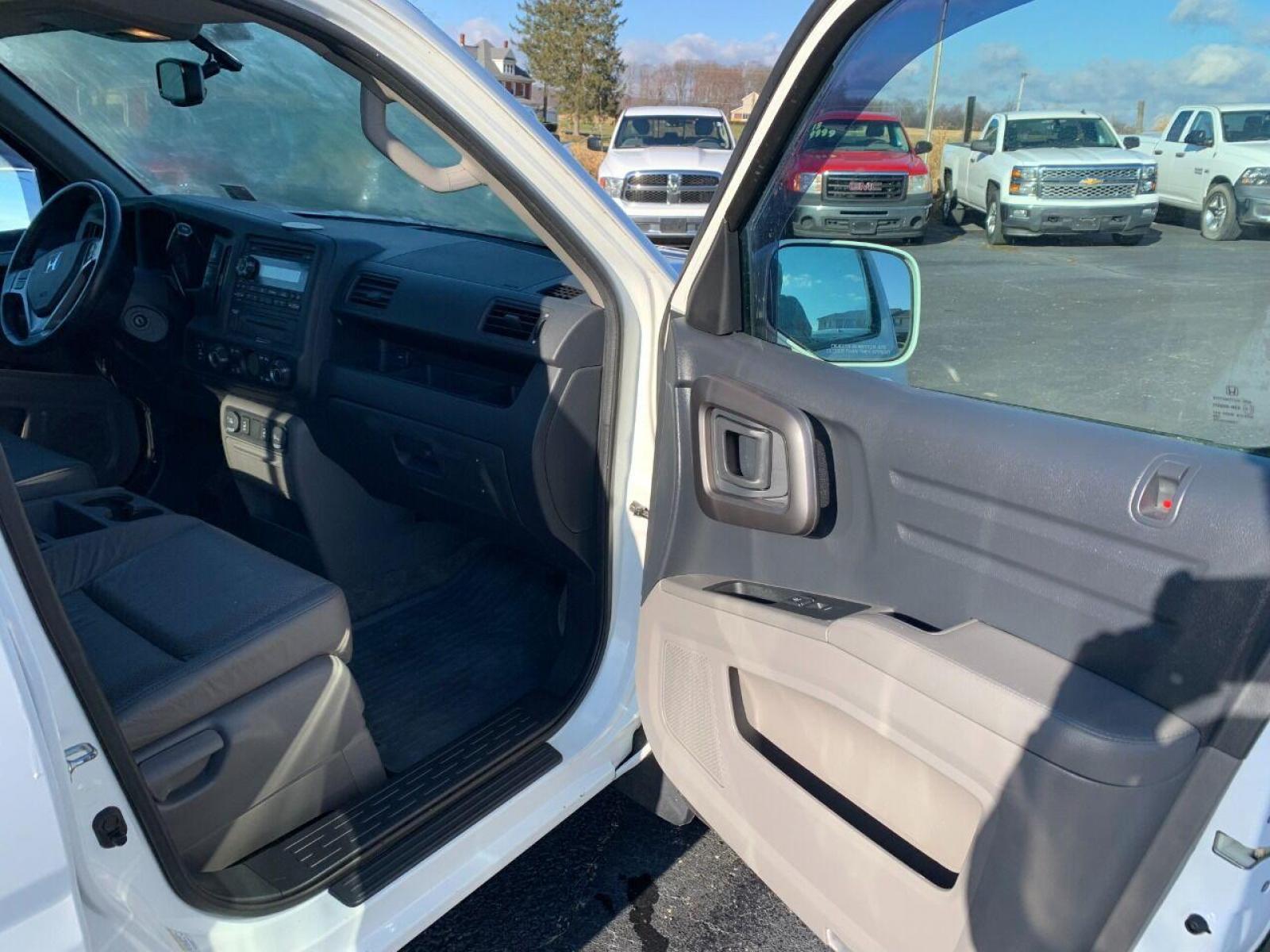 2014 White Honda Ridgeline (5FPYK1F54EB) with an 3.5L V6 3.5L V6 engine, located at 4845 Woodbury Pike, Roaring Springs, PA, (814) 317-5008, (814) 317-5008, 40.250935, -78.366959 - 2014 Honda Ridgeline, automatic, V6, 64k, 4x4, leather, roof, power windows/locks, cruise/tilt wheel, air conditioning, like new tires, new inspection and more. Rust free! Must see condition! Vehicle is only being sold cheaper due to having a Reconstructed title. Truck had damage to lower contr - Photo #7