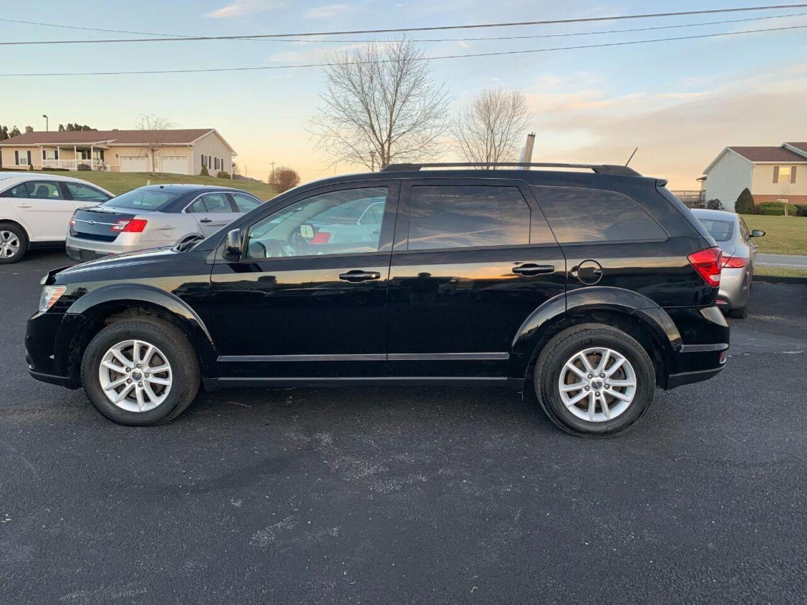 2017 Black Dodge Journey (3C4PDCBG9HT) with an 3.6L V6 3.6L V6 engine, located at 4845 Woodbury Pike, Roaring Springs, PA, (814) 317-5008, (814) 317-5008, 40.250935, -78.366959 - 2017 Dodge Journey SXT , automatic, FWD, third row, 98k, power windows/locks, cruise/tilt wheel, air conditioning, V6, like new tires, new inspection and more. Super clean! Must see to appreciate! Will come with a warranty with the option to upgrade. If interested, please call 814-317-5008. - Photo #0