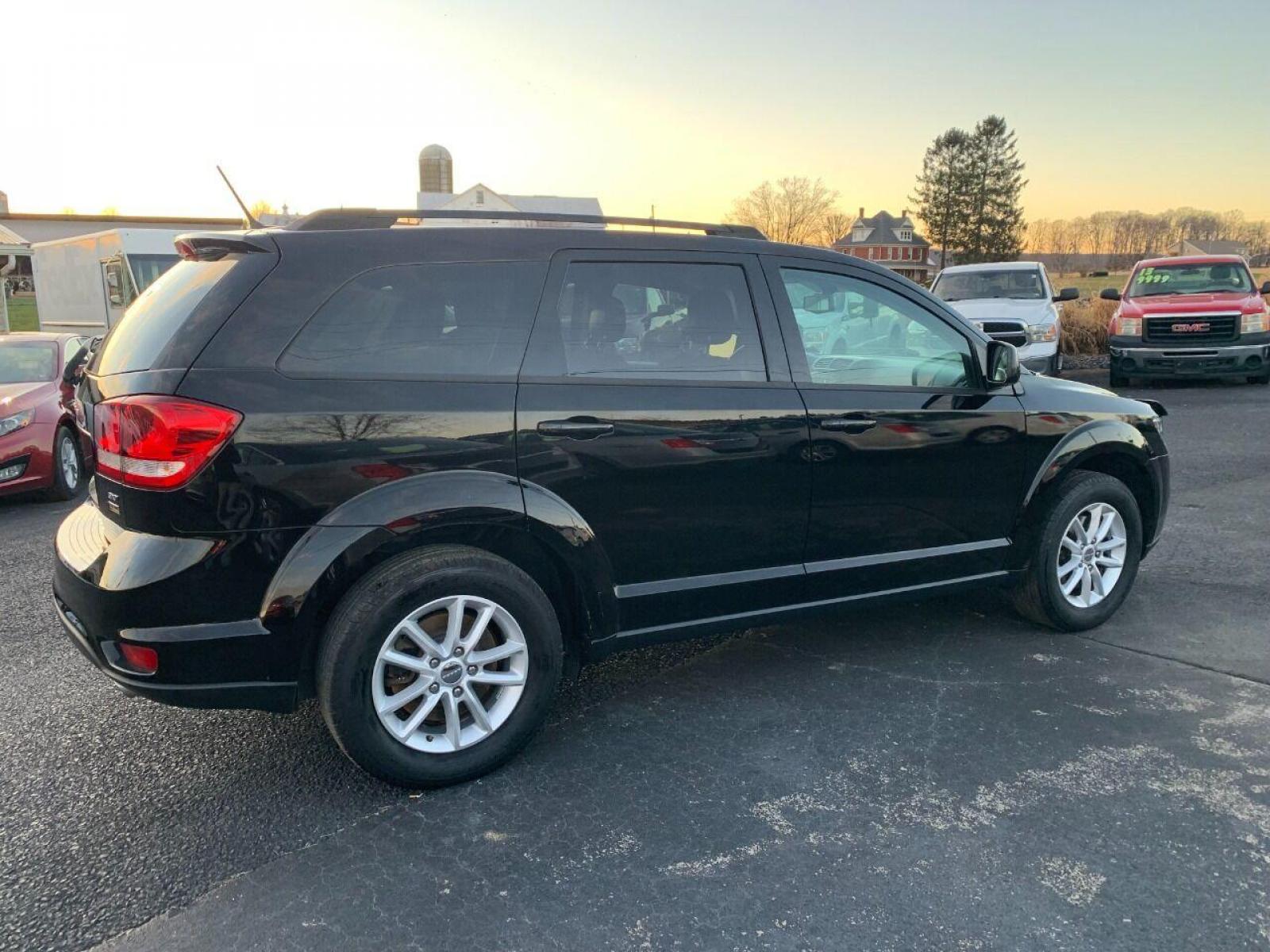 2017 Black Dodge Journey (3C4PDCBG9HT) with an 3.6L V6 3.6L V6 engine, located at 4845 Woodbury Pike, Roaring Springs, PA, (814) 317-5008, (814) 317-5008, 40.250935, -78.366959 - Photo #1