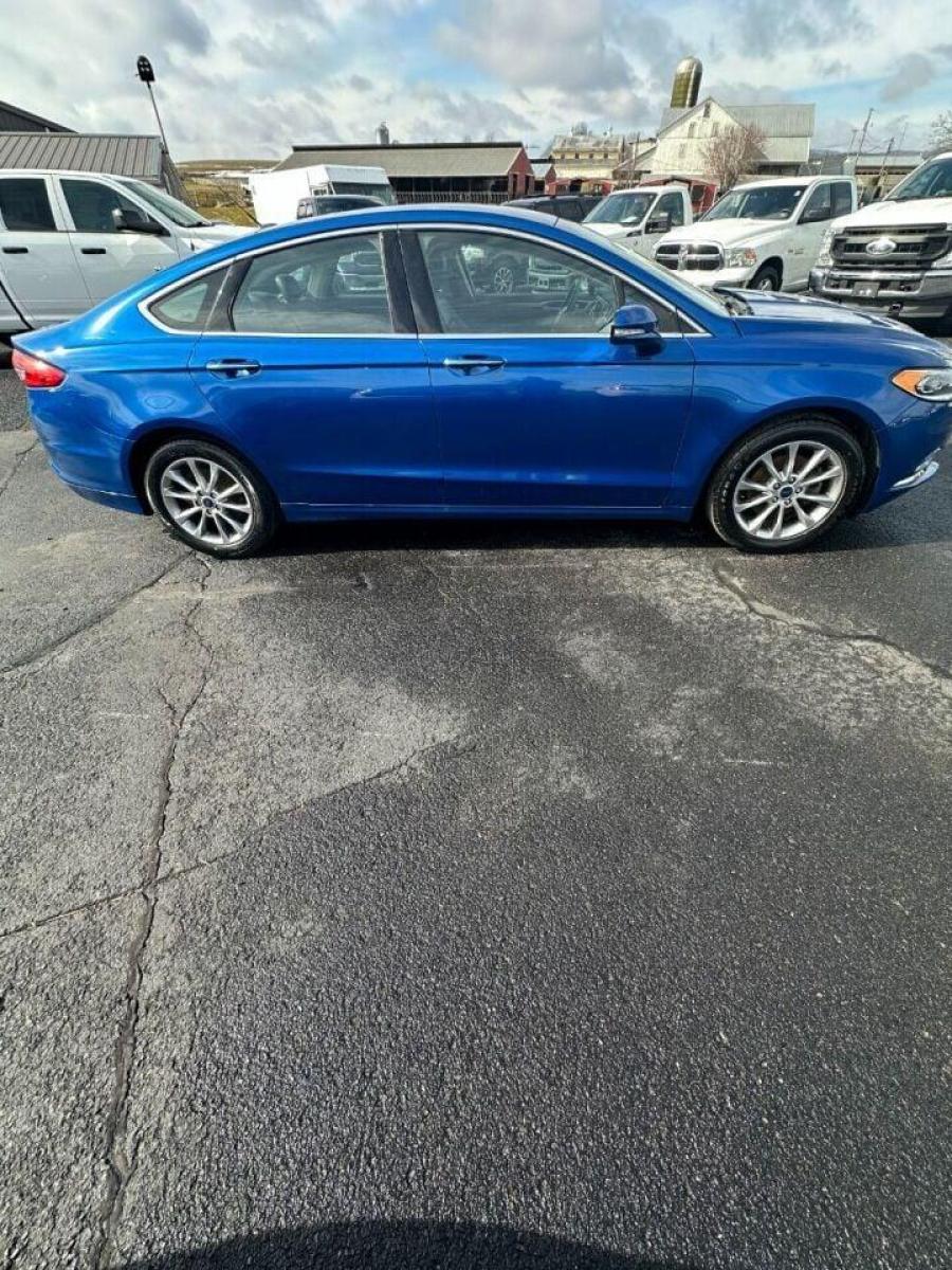2017 Blue Ford Fusion (3FA6P0HD7HR) with an 1.5L I4 Turbocharger 1.5L I4 engine, located at 4845 Woodbury Pike, Roaring Springs, PA, (814) 317-5008, (814) 317-5008, 40.250935, -78.366959 - Photo #1