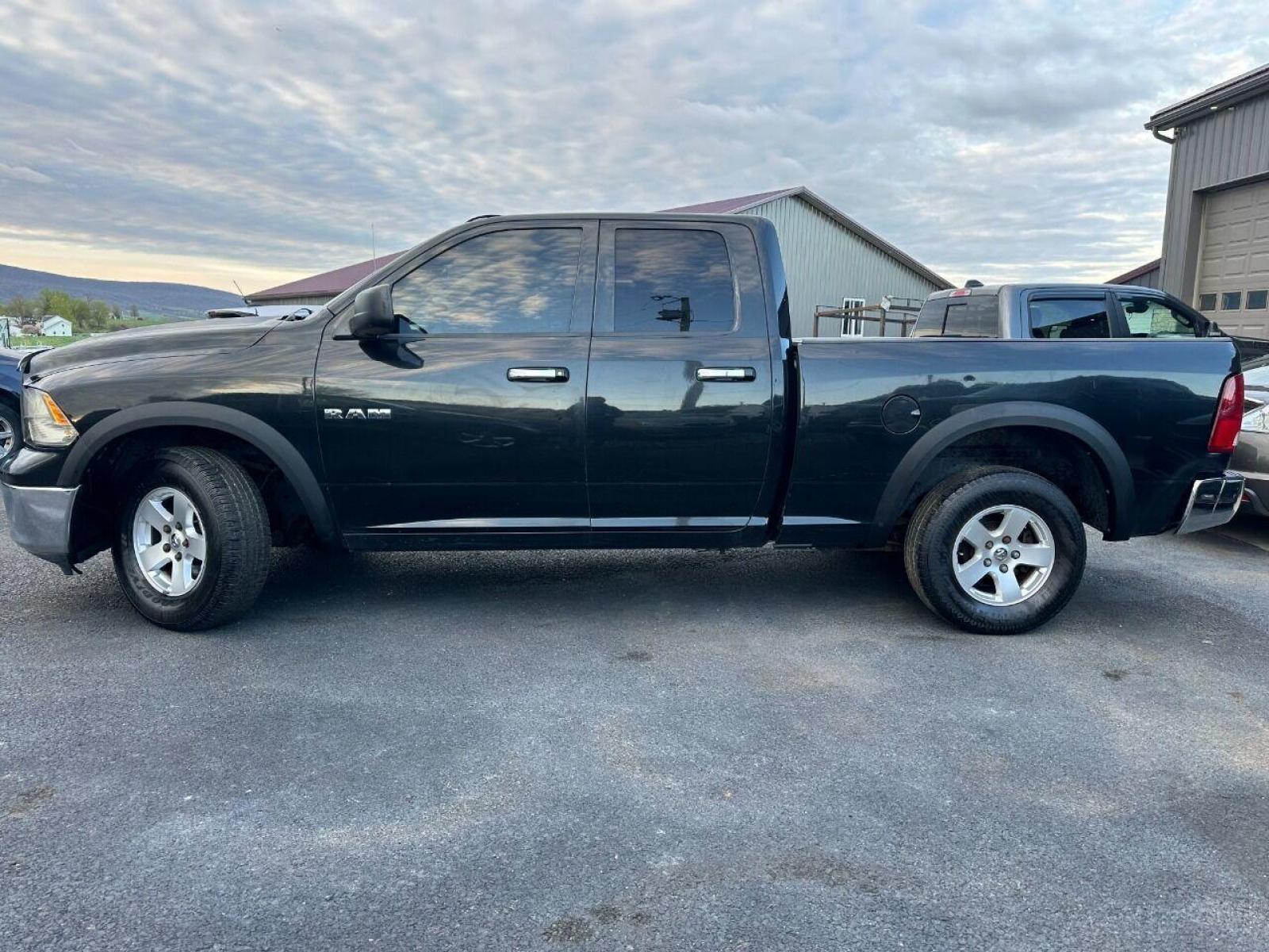 2010 Black Dodge Ram 1500 (1D7RV1GP9AS) with an 4.7L V8 4.7L V8 engine, located at 4845 Woodbury Pike, Roaring Springs, PA, (814) 317-5008, (814) 317-5008, 40.250935, -78.366959 - 2010 Dodge Ram SLT 1500, automatic, 4.7L, 227k, CD, air conditioning, power windows/locks, cruise/tilt wheel, two new tires and brake calipers on the front. Runs and drives good. Not a rusted out truck! Good shape! Truck is being sold as is. Truck has a reconstructed title due to rear bumper an - Photo #1
