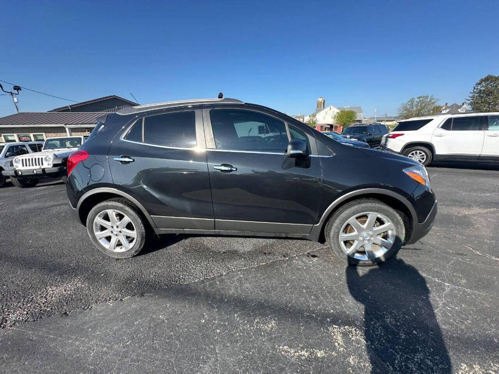 2015 Black Buick Encore (KL4CJHSB4FB) with an 1.4L I4 Turbocharger 1.4L I4 engine, located at 4845 Woodbury Pike, Roaring Springs, PA, (814) 317-5008, (814) 317-5008, 40.250935, -78.366959 - 2015 Buick Encore Premium, AWD, leather, roof, power windows/locks/seats and mirrors, rain sensing windshield, park assist, hands free phone, cruise/tilt wheel and much more. Clean! Ready to go with new inspection! Warranty available! If interested, 814-317-5008 or 814-497-4383. - Photo #1