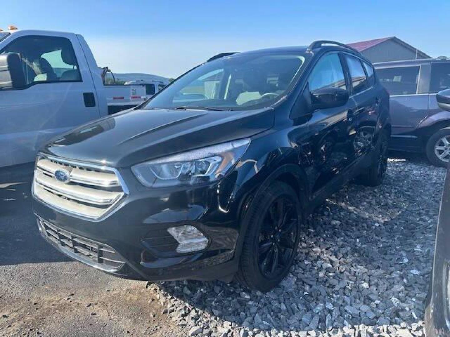 2019 Black Ford Escape (1FMCU9GDXKU) with an 1.5L I4 Turbocharger 1.5L I4 engine, located at 4845 Woodbury Pike, Roaring Springs, PA, (814) 317-5008, (814) 317-5008, 40.250935, -78.366959 - 2019 FORD ESCAPE AWD 1.5 L I4 TURBO ALL WHEEL DRIVE, BLACK OUT PACKAGE AUTOMATIC TRANSMISSION A/C ALL LEATHER AND HEATED SEATS.NAVIGATION POWER GATE POWER WINDOWS AND LOCKS SIRIUS RADIO.BACK UP CAMERA BLACK WHEELS BLUE TOOTH. NEW TIRES RUN GREAT NEW INSPECTION BEING SOLD AT LOWER COST BECAUSE IT IS - Photo#1