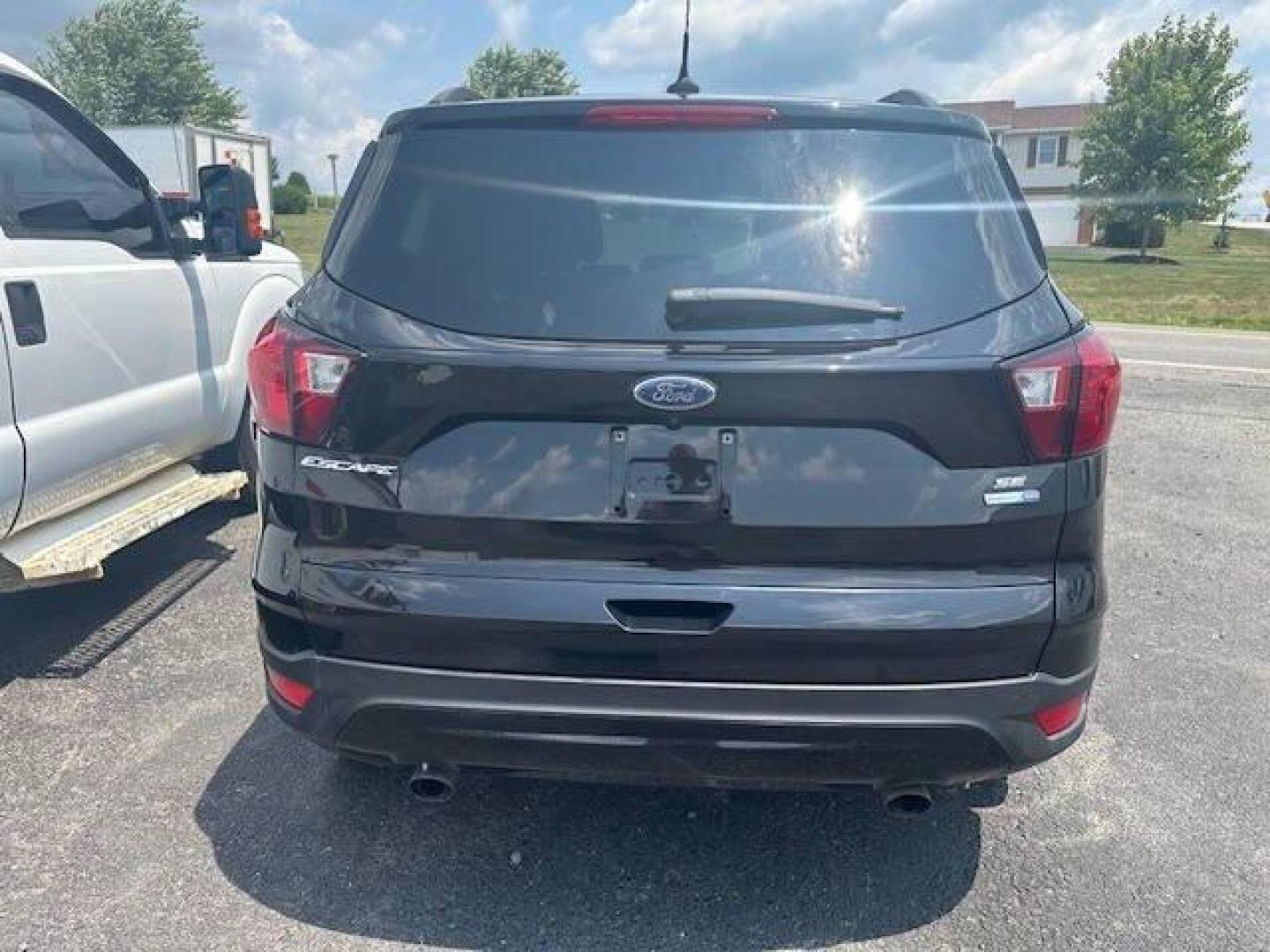 2019 Black Ford Escape (1FMCU9GDXKU) with an 1.5L I4 Turbocharger 1.5L I4 engine, located at 4845 Woodbury Pike, Roaring Springs, PA, (814) 317-5008, (814) 317-5008, 40.250935, -78.366959 - 2019 FORD ESCAPE AWD 1.5 L I4 TURBO ALL WHEEL DRIVE, BLACK OUT PACKAGE AUTOMATIC TRANSMISSION A/C ALL LEATHER AND HEATED SEATS.NAVIGATION POWER GATE POWER WINDOWS AND LOCKS SIRIUS RADIO.BACK UP CAMERA BLACK WHEELS BLUE TOOTH. NEW TIRES RUN GREAT NEW INSPECTION BEING SOLD AT LOWER COST BECAUSE IT IS - Photo#4
