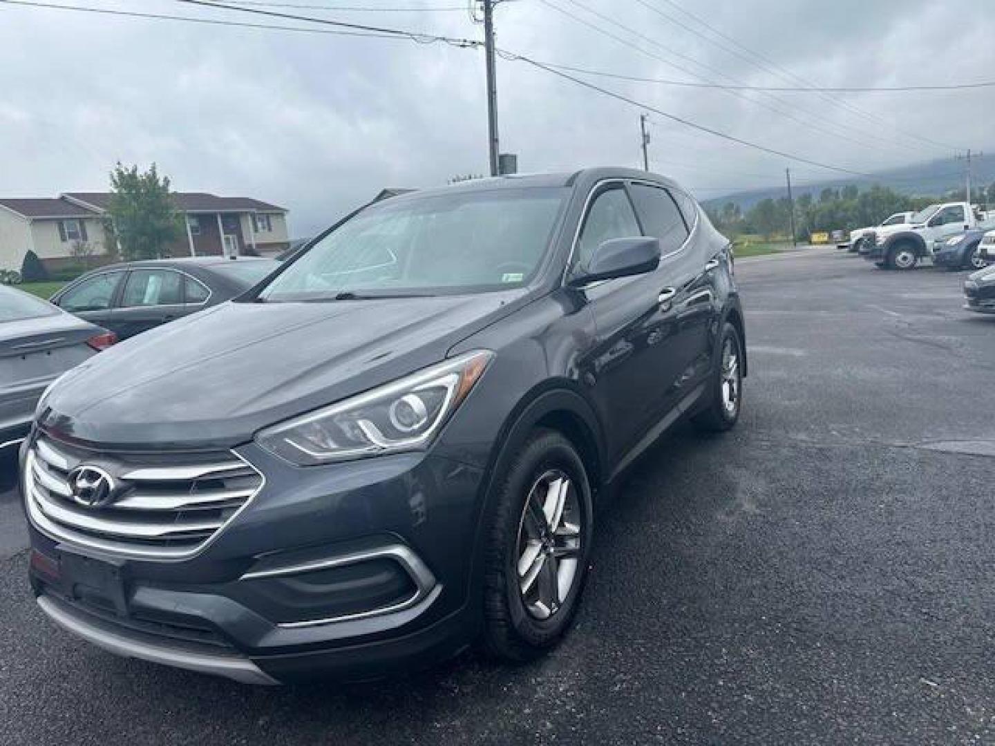 2018 Black Hyundai Santa Fe Sport (5XYZTDLB2JG) with an 2.4L I4 2.4L I4 engine, located at 4845 Woodbury Pike, Roaring Springs, PA, (814) 317-5008, (814) 317-5008, 40.250935, -78.366959 - 2018 HYUNDIA SANTAFE 2.4 L ENGINE AUTOMATIC TRANSMISSION POWER WINDOW, POWER MIRRORS, MANUAL SEAT, NEWER TIRES AND NEW STATE INSPECTION, VERY CLEAN CAR, WARRANTY IS AVAILABLE WITH CAR IF INTRESTED STOP BY FOR A TEST DRIVE OR GIVE US A CALL - Photo#0