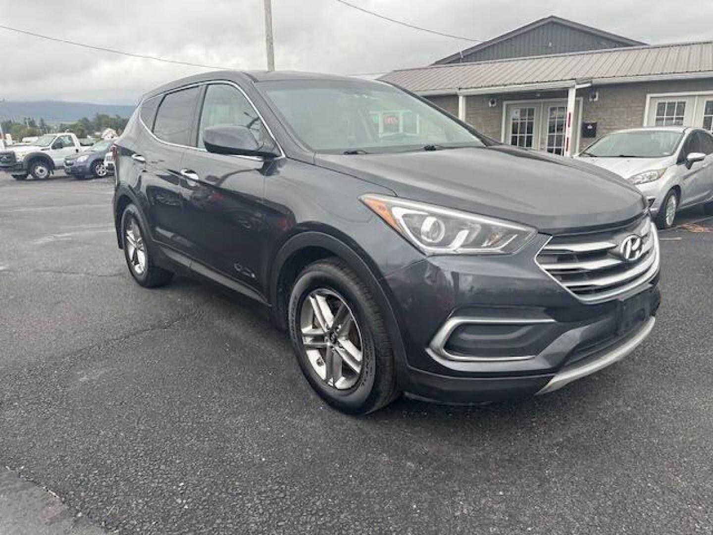 2018 Black Hyundai Santa Fe Sport (5XYZTDLB2JG) with an 2.4L I4 2.4L I4 engine, located at 4845 Woodbury Pike, Roaring Springs, PA, (814) 317-5008, (814) 317-5008, 40.250935, -78.366959 - 2018 HYUNDIA SANTAFE 2.4 L ENGINE AUTOMATIC TRANSMISSION POWER WINDOW, POWER MIRRORS, MANUAL SEAT, NEWER TIRES AND NEW STATE INSPECTION, VERY CLEAN CAR, WARRANTY IS AVAILABLE WITH CAR IF INTRESTED STOP BY FOR A TEST DRIVE OR GIVE US A CALL - Photo#1