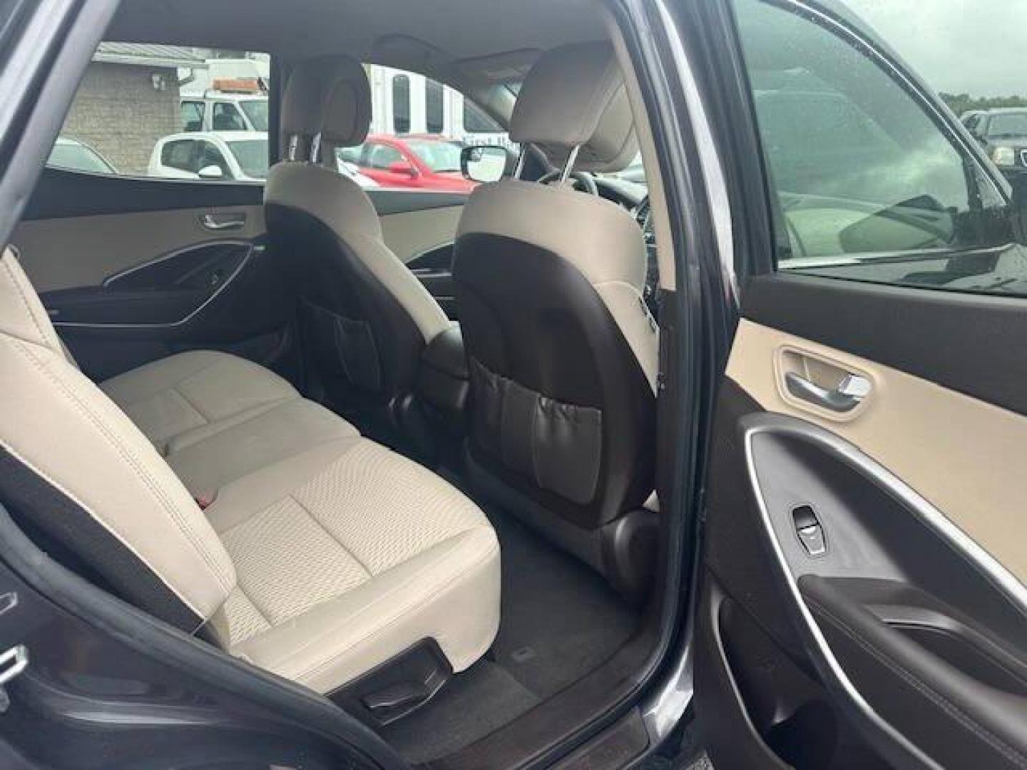 2018 Black Hyundai Santa Fe Sport (5XYZTDLB2JG) with an 2.4L I4 2.4L I4 engine, located at 4845 Woodbury Pike, Roaring Springs, PA, (814) 317-5008, (814) 317-5008, 40.250935, -78.366959 - 2018 HYUNDIA SANTAFE 2.4 L ENGINE AUTOMATIC TRANSMISSION POWER WINDOW, POWER MIRRORS, MANUAL SEAT, NEWER TIRES AND NEW STATE INSPECTION, VERY CLEAN CAR, WARRANTY IS AVAILABLE WITH CAR IF INTRESTED STOP BY FOR A TEST DRIVE OR GIVE US A CALL - Photo#3