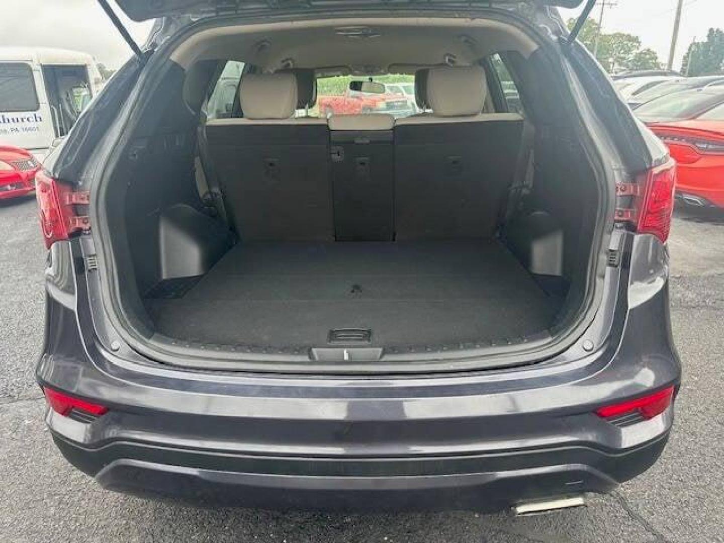 2018 Black Hyundai Santa Fe Sport (5XYZTDLB2JG) with an 2.4L I4 2.4L I4 engine, located at 4845 Woodbury Pike, Roaring Springs, PA, (814) 317-5008, (814) 317-5008, 40.250935, -78.366959 - 2018 HYUNDIA SANTAFE 2.4 L ENGINE AUTOMATIC TRANSMISSION POWER WINDOW, POWER MIRRORS, MANUAL SEAT, NEWER TIRES AND NEW STATE INSPECTION, VERY CLEAN CAR, WARRANTY IS AVAILABLE WITH CAR IF INTRESTED STOP BY FOR A TEST DRIVE OR GIVE US A CALL - Photo#4