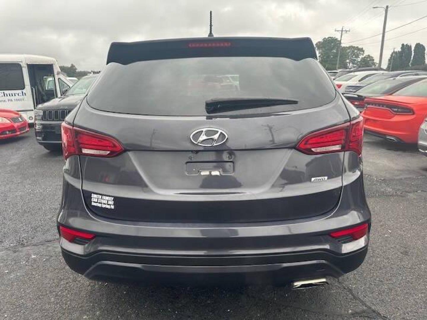 2018 Black Hyundai Santa Fe Sport (5XYZTDLB2JG) with an 2.4L I4 2.4L I4 engine, located at 4845 Woodbury Pike, Roaring Springs, PA, (814) 317-5008, (814) 317-5008, 40.250935, -78.366959 - 2018 HYUNDIA SANTAFE 2.4 L ENGINE AUTOMATIC TRANSMISSION POWER WINDOW, POWER MIRRORS, MANUAL SEAT, NEWER TIRES AND NEW STATE INSPECTION, VERY CLEAN CAR, WARRANTY IS AVAILABLE WITH CAR IF INTRESTED STOP BY FOR A TEST DRIVE OR GIVE US A CALL - Photo#5