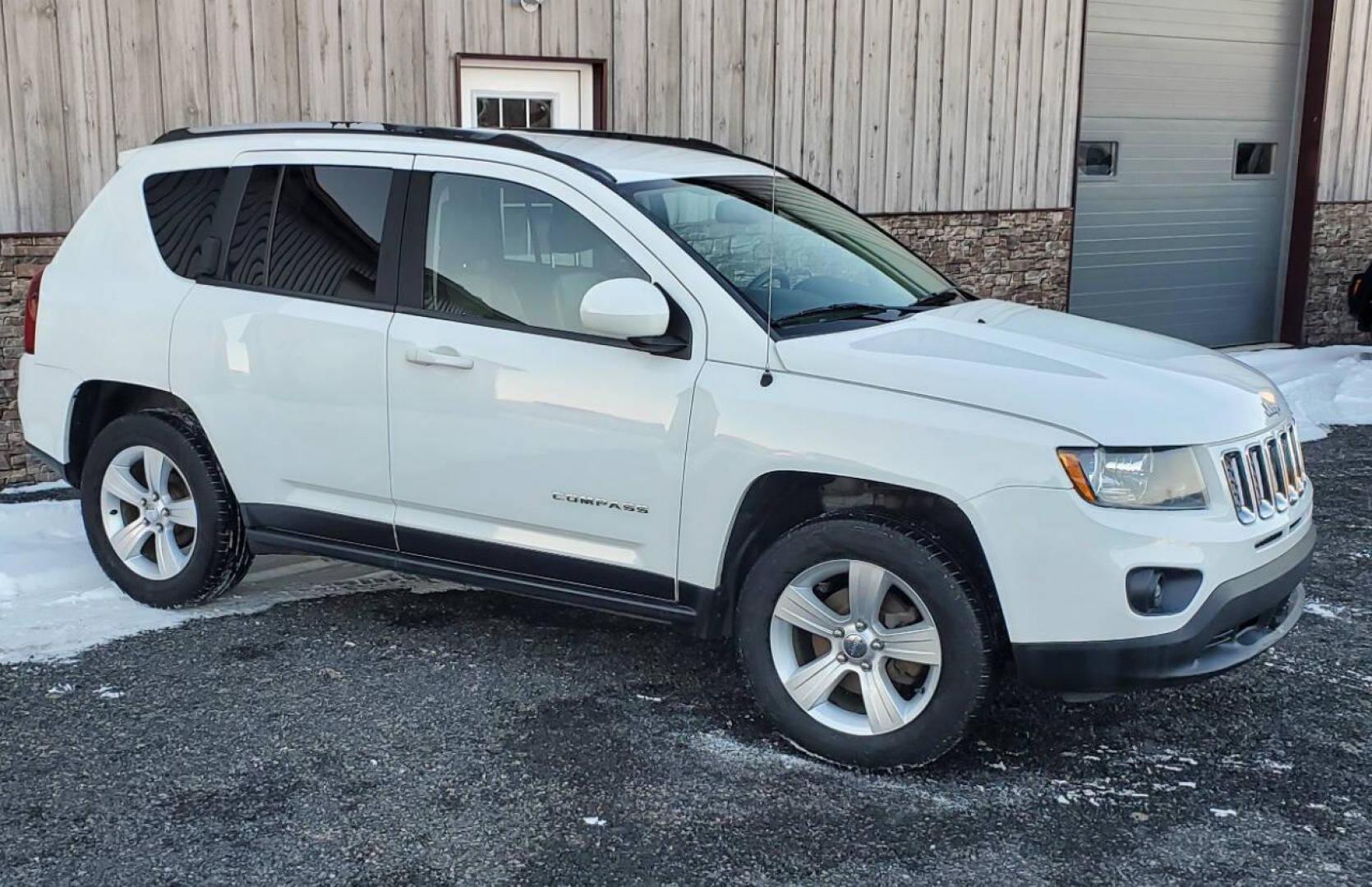 2015 White /Gray/Black Jeep Compass (1C4NJDEB2FD) with an 2.4L I4 2.4L I4 engine, located at 4845 Woodbury Pike, Roaring Springs, PA, (814) 317-5008, (814) 317-5008, 40.250935, -78.366959 - 2015 Jeep Compass Latitude 4x4 4dr SUV, 2.4L 4-cyclinder Automatic, leather heated seats, aluminum wheels. Super clean with no rust. Selling so cheap due to vehicle having rear bumper taillight damage. We replaced it with one the same color. Vehicle runs and drives 100% with no issues, but it does h - Photo#1