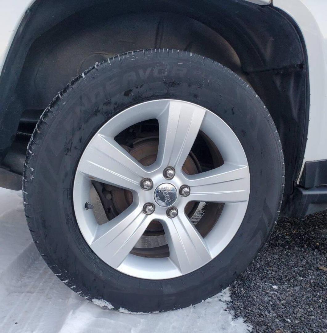 2015 White /Gray/Black Jeep Compass (1C4NJDEB2FD) with an 2.4L I4 2.4L I4 engine, located at 4845 Woodbury Pike, Roaring Springs, PA, (814) 317-5008, (814) 317-5008, 40.250935, -78.366959 - 2015 Jeep Compass Latitude 4x4 4dr SUV, 2.4L 4-cyclinder Automatic, leather heated seats, aluminum wheels. Super clean with no rust. Selling so cheap due to vehicle having rear bumper taillight damage. We replaced it with one the same color. Vehicle runs and drives 100% with no issues, but it does h - Photo#5
