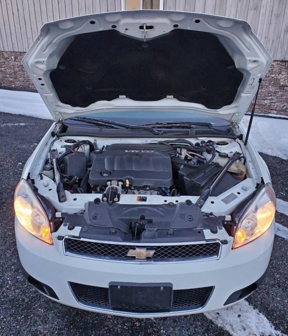 2015 White Chevrolet Impala Limited (2G1WD5E37F1) with an 3.6L V6 3.6L V6 engine, located at 4845 Woodbury Pike, Roaring Springs, PA, (814) 317-5008, (814) 317-5008, 40.250935, -78.366959 - 2015 Chevrolet Impala Limited automatic, 164k, FWD, power windows/locks, cruise/tilt wheel, air conditioning, new inspection. Flex fuel! Southern vehicle from Virginia. Well maintained! Clean! Will come with a 3 month/4500-mile power train warranty with the option to upgrade. To see a full list of t - Photo#4