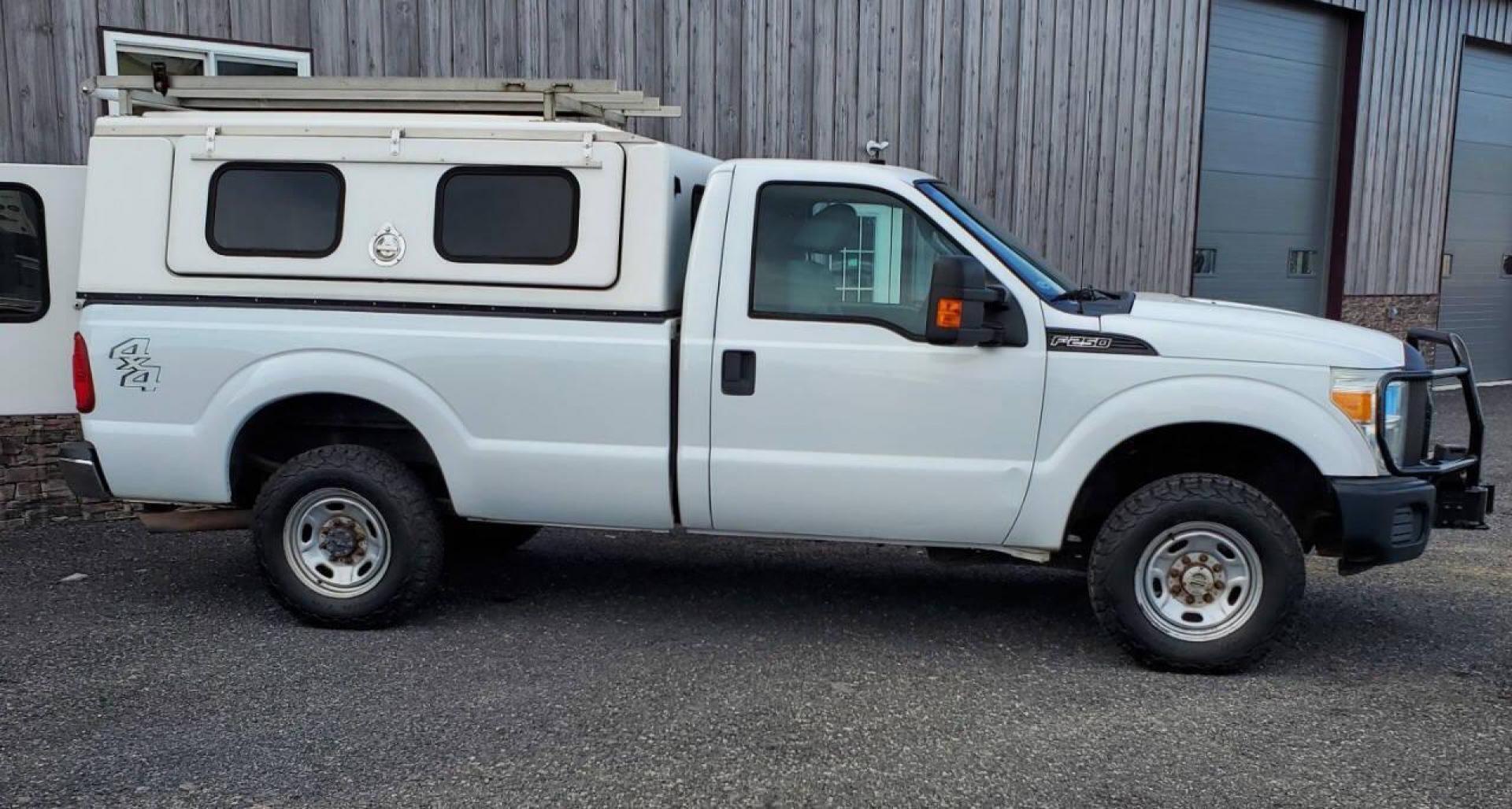 2011 White Ford F-250 Super Duty (1FTBF2B68BE) with an 6.2L V8 6.2L V8 engine, located at 4845 Woodbury Pike, Roaring Springs, PA, (814) 317-5008, (814) 317-5008, 40.250935, -78.366959 - 2011 Ford F250 4X4 V8 8' bed Flex Fuel Lots of tread left on the tires. One owner government owned, well maintained. Clean truck! Being priced low due to bed rails have some holes, body is rust free. Will come with a new inspection. If you would like more info on this vehicle or any of the others w - Photo#1