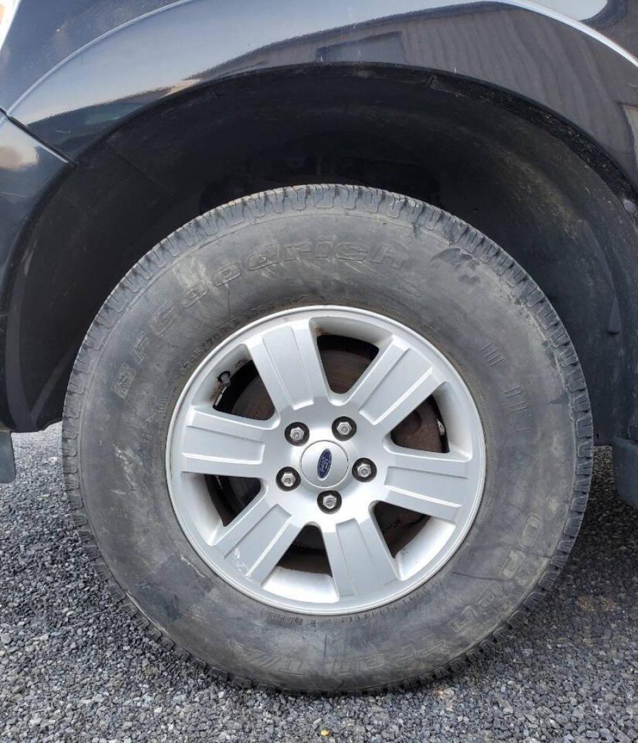 2008 Black Ford Explorer (1FMEU73E98U) with an 4.0L V6 4.0L V6 engine, located at 4845 Woodbury Pike, Roaring Springs, PA, (814) 317-5008, (814) 317-5008, 40.250935, -78.366959 - Please read entire description!! This vehicle will need towed!! 2008 Ford Explorer XLT 4X4 4.0L V6 Automatic 154,575 miles New tires, leather seats, not a rusty vehicle and it's ready for inspection. This vehicle does have a salvage title due to rear deck lid damage. Small antifreeze leak near the - Photo#5