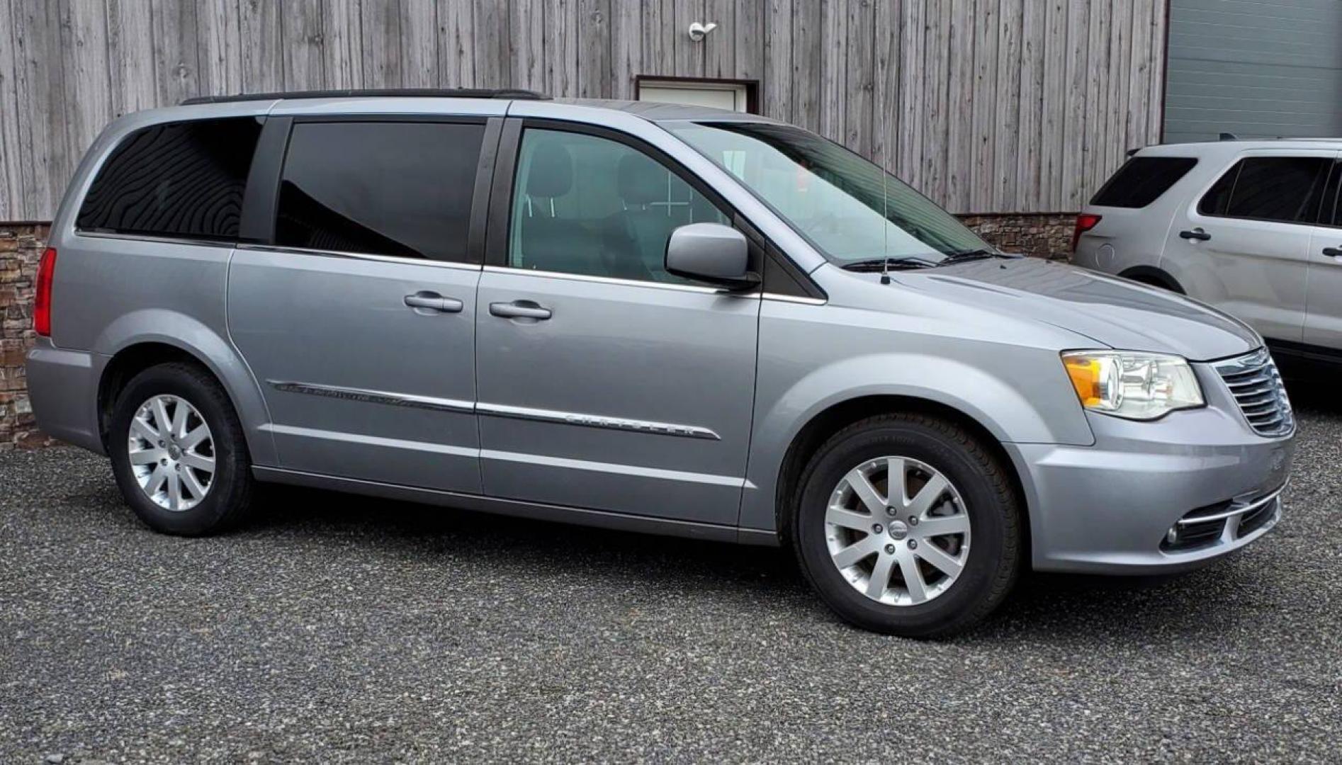 2014 Silver Chrysler Town and Country (2C4RC1BG8ER) with an 3.6L V6 3.6L V6 engine, located at 4845 Woodbury Pike, Roaring Springs, PA, (814) 317-5008, (814) 317-5008, 40.250935, -78.366959 - 2014 Chrysler Town and Country Touring 3.6L V6 FWD Automatic 124K miles Flex Fuel 3rd row seating, A/C, CD Player, Sirius, Bluetooth, Back-up Camera, Rear DVD Player, Leather-trimmed Seats Vehicle has R-Title due to right/front damage to headlight/bumper/grill. New Inspection. Vehicle comes with 3 m - Photo#1