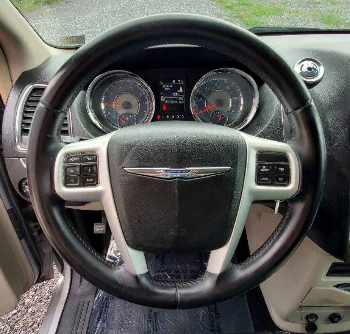 2014 Silver Chrysler Town and Country (2C4RC1BG8ER) with an 3.6L V6 3.6L V6 engine, located at 4845 Woodbury Pike, Roaring Springs, PA, (814) 317-5008, (814) 317-5008, 40.250935, -78.366959 - 2014 Chrysler Town and Country Touring 3.6L V6 FWD Automatic 124K miles Flex Fuel 3rd row seating, A/C, CD Player, Sirius, Bluetooth, Back-up Camera, Rear DVD Player, Leather-trimmed Seats Vehicle has R-Title due to right/front damage to headlight/bumper/grill. New Inspection. Vehicle comes with 3 m - Photo#16