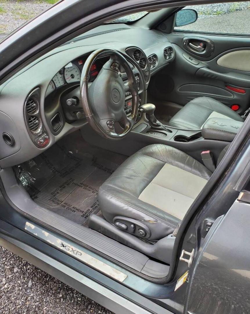 2004 Gray Pontiac Bonneville (1G2HZ54Y94U) with an 4.6L V8 4.6L V8 engine, located at 4845 Woodbury Pike, Roaring Springs, PA, (814) 317-5008, (814) 317-5008, 40.250935, -78.366959 - 2004 Pontiac Bonneville GXP 4.6L V8 Automatic FWD 95K miles A/C, Cruise Control, Keyless Entry, CD Player and Cassette Player, OnStar, Power Windows and Door Locks New Inspection Will come with 3mo/3,000-mile warranty with option to upgrade. If interested, please call 814-317-5008 - Photo#8