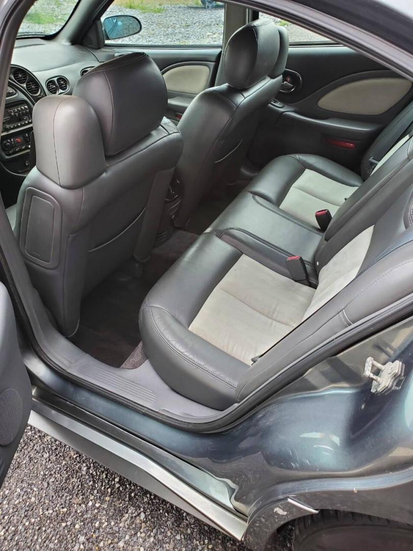 2004 Gray Pontiac Bonneville (1G2HZ54Y94U) with an 4.6L V8 4.6L V8 engine, located at 4845 Woodbury Pike, Roaring Springs, PA, (814) 317-5008, (814) 317-5008, 40.250935, -78.366959 - 2004 Pontiac Bonneville GXP 4.6L V8 Automatic FWD 95K miles A/C, Cruise Control, Keyless Entry, CD Player and Cassette Player, OnStar, Power Windows and Door Locks New Inspection Will come with 3mo/3,000-mile warranty with option to upgrade. If interested, please call 814-317-5008 - Photo#10