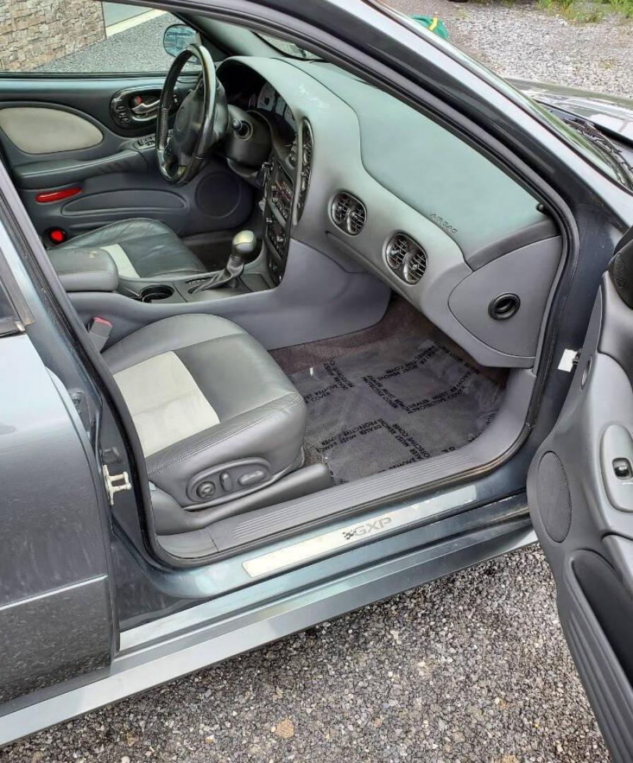 2004 Gray Pontiac Bonneville (1G2HZ54Y94U) with an 4.6L V8 4.6L V8 engine, located at 4845 Woodbury Pike, Roaring Springs, PA, (814) 317-5008, (814) 317-5008, 40.250935, -78.366959 - 2004 Pontiac Bonneville GXP 4.6L V8 Automatic FWD 95K miles A/C, Cruise Control, Keyless Entry, CD Player and Cassette Player, OnStar, Power Windows and Door Locks New Inspection Will come with 3mo/3,000-mile warranty with option to upgrade. If interested, please call 814-317-5008 - Photo#12