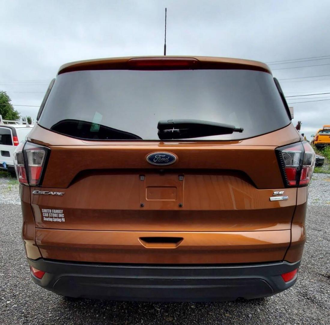 2017 Canyon Ridge Metallic Ford Escape (1FMCU0F76HU) with an 2.5L I4 2.5L I4 engine, located at 4845 Woodbury Pike, Roaring Springs, PA, (814) 317-5008, (814) 317-5008, 40.250935, -78.366959 - 2017 Ford Escape S 2.5L I4 Automatic FWD 93K miles Power Windows and Locks, A/C, CD Player, SYNC, Back-up Camera Nice Southern Vehicle! New Inspection. Vehicle comes with 3 mo./3,000-mile warranty with the option to upgrade. If interested, please call 814-317-5008 - Photo#2