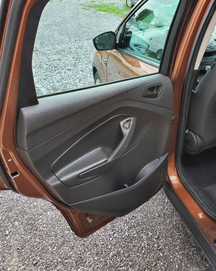 2017 Canyon Ridge Metallic Ford Escape (1FMCU0F76HU) with an 2.5L I4 2.5L I4 engine, located at 4845 Woodbury Pike, Roaring Springs, PA, (814) 317-5008, (814) 317-5008, 40.250935, -78.366959 - 2017 Ford Escape S 2.5L I4 Automatic FWD 93K miles Power Windows and Locks, A/C, CD Player, SYNC, Back-up Camera Nice Southern Vehicle! New Inspection. Vehicle comes with 3 mo./3,000-mile warranty with the option to upgrade. If interested, please call 814-317-5008 - Photo#11