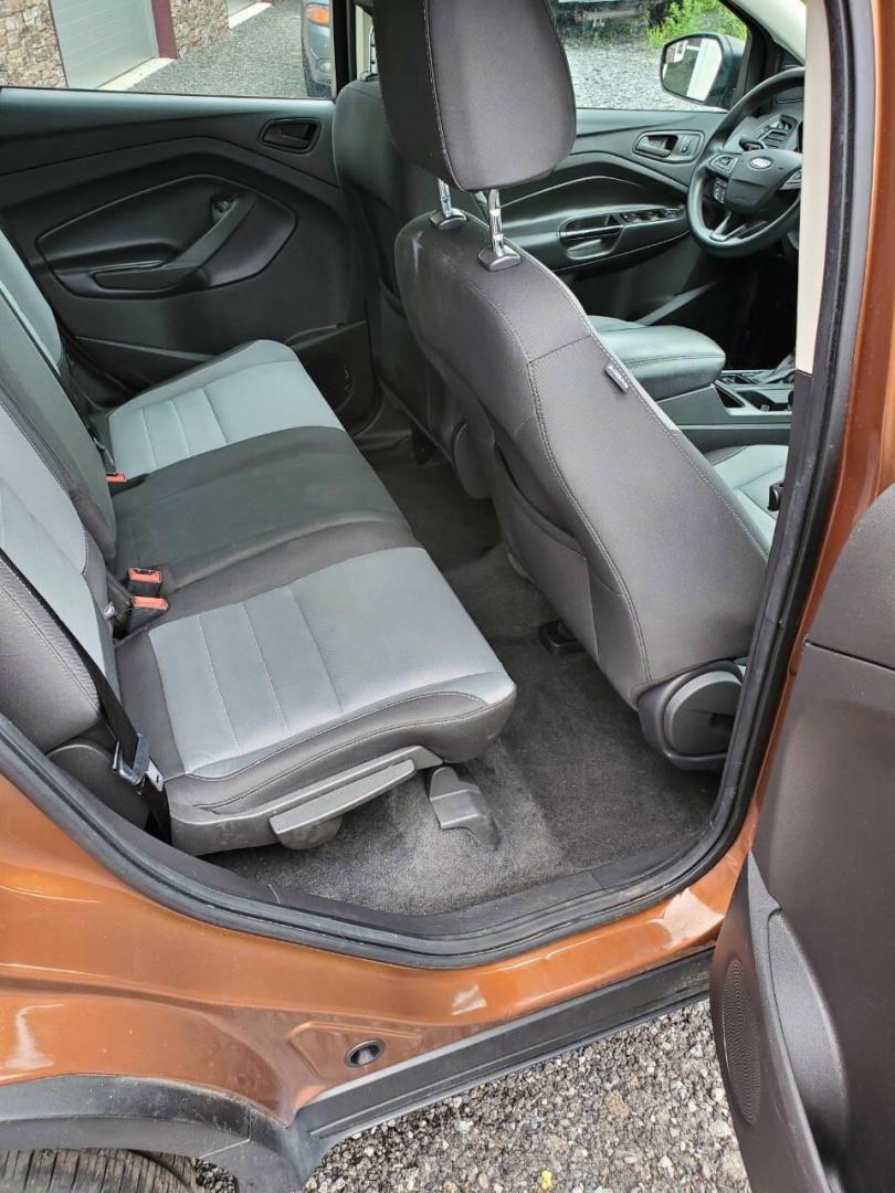 2017 Canyon Ridge Metallic Ford Escape (1FMCU0F76HU) with an 2.5L I4 2.5L I4 engine, located at 4845 Woodbury Pike, Roaring Springs, PA, (814) 317-5008, (814) 317-5008, 40.250935, -78.366959 - 2017 Ford Escape S 2.5L I4 Automatic FWD 93K miles Power Windows and Locks, A/C, CD Player, SYNC, Back-up Camera Nice Southern Vehicle! New Inspection. Vehicle comes with 3 mo./3,000-mile warranty with the option to upgrade. If interested, please call 814-317-5008 - Photo#14