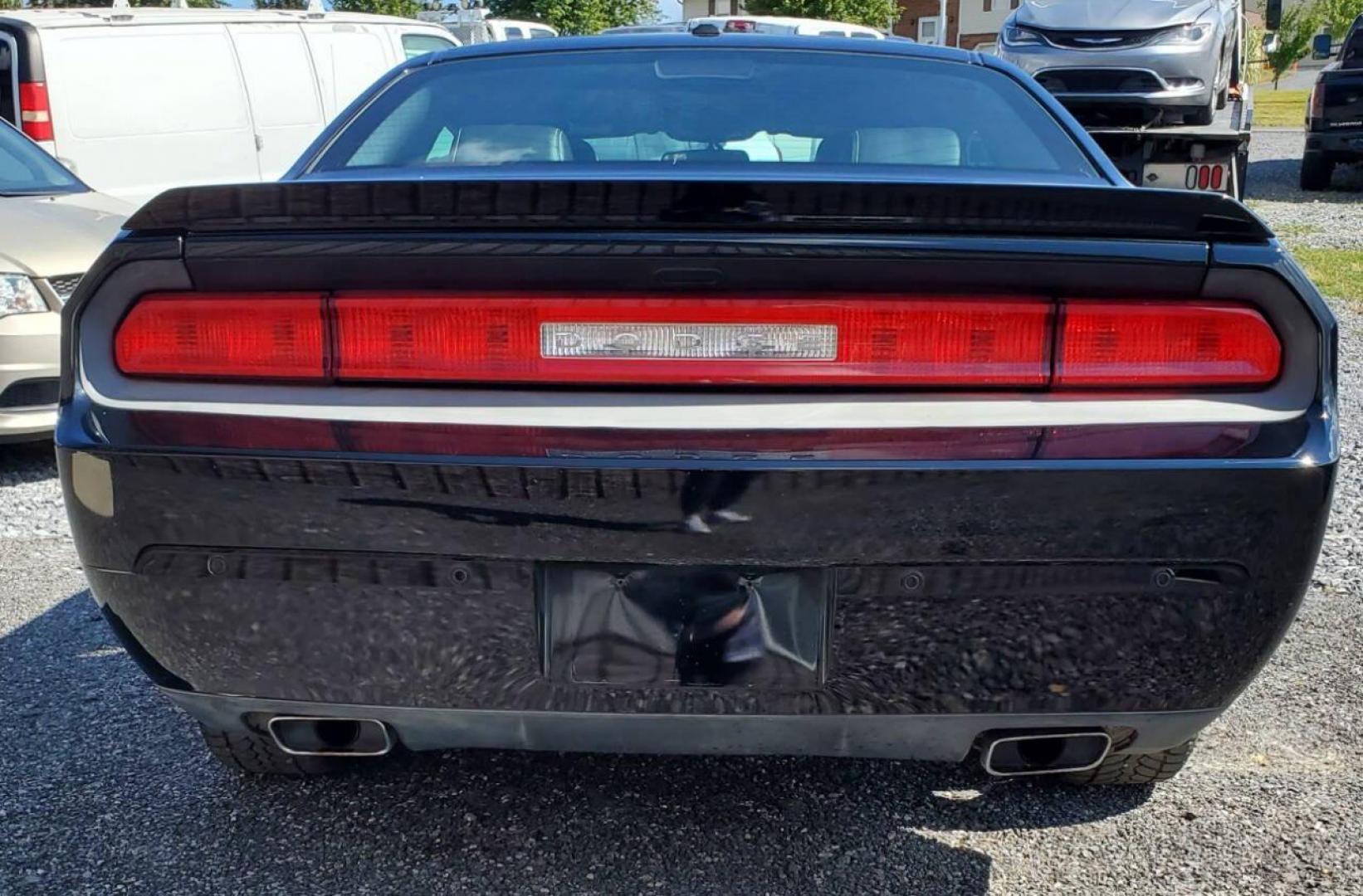 2013 Black Dodge Challenger (2C3CDYAG0DH) with an 3.6L V6 3.6L V6 engine, located at 4845 Woodbury Pike, Roaring Springs, PA, (814) 317-5008, (814) 317-5008, 40.250935, -78.366959 - 2013 Dodge Challenger SXT Plus 3.6L V6 Automatic 80K Miles Leather Seats, Cold A/C, Like New Tires, Keyless Entry, Single CD, Sirius XM, Bluetooth, Heated Driver and Passenger Seats, Braking Assist, New Inspection. Clean Southern Vehicle! It will come with a 3 mo./3,000-mile warranty with the option - Photo#2