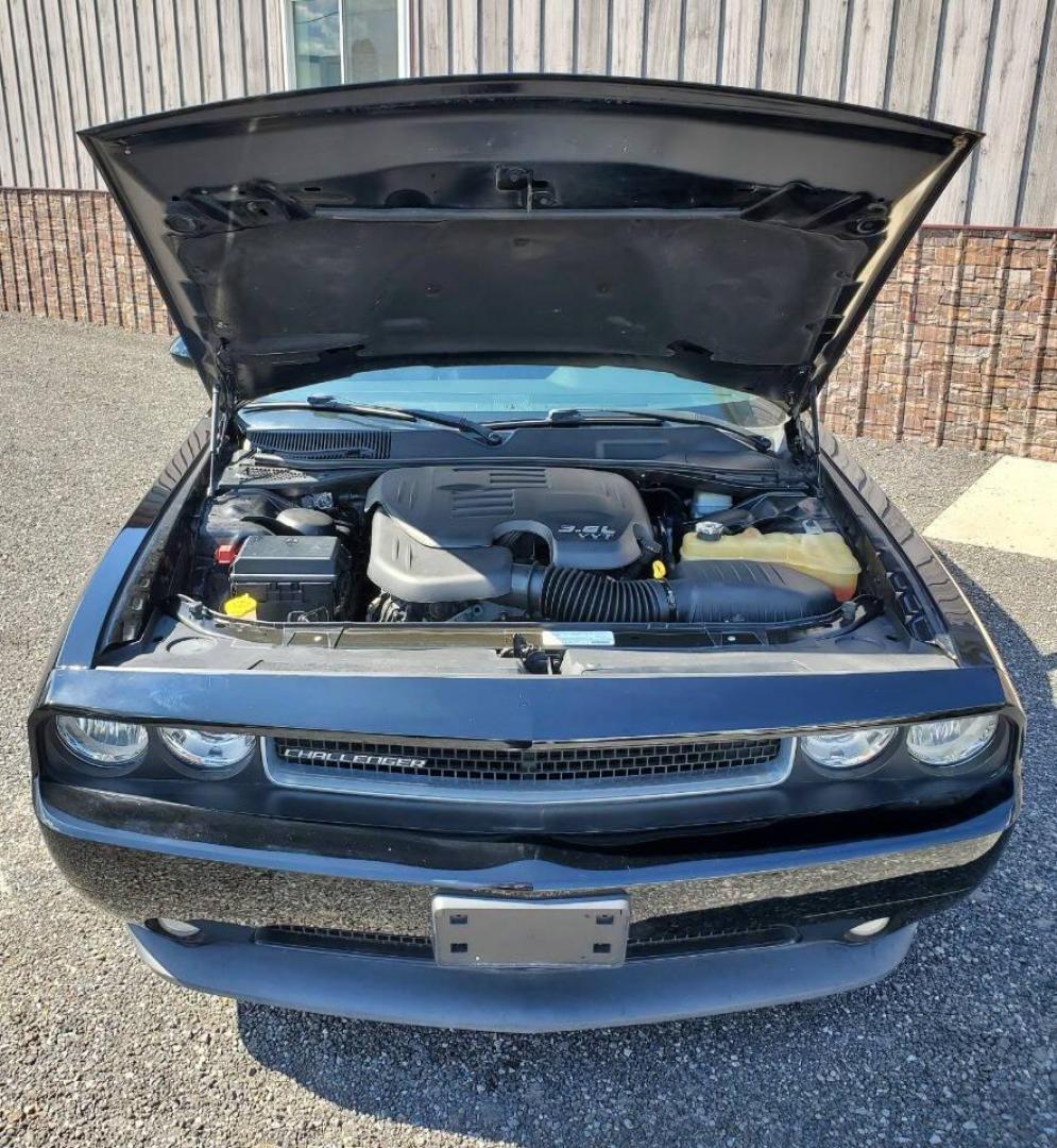 2013 Black Dodge Challenger (2C3CDYAG0DH) with an 3.6L V6 3.6L V6 engine, located at 4845 Woodbury Pike, Roaring Springs, PA, (814) 317-5008, (814) 317-5008, 40.250935, -78.366959 - 2013 Dodge Challenger SXT Plus 3.6L V6 Automatic 80K Miles Leather Seats, Cold A/C, Like New Tires, Keyless Entry, Single CD, Sirius XM, Bluetooth, Heated Driver and Passenger Seats, Braking Assist, New Inspection. Clean Southern Vehicle! It will come with a 3 mo./3,000-mile warranty with the option - Photo#5