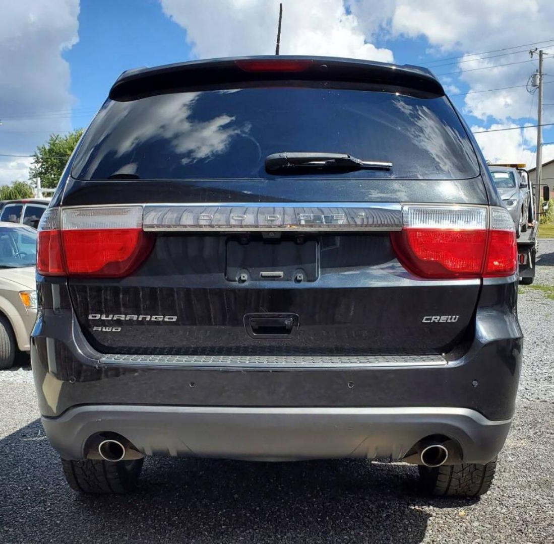 2013 Black Dodge Durango (1C4SDJDT3DC) with an 5.7L V8 5.7L V8 engine, located at 4845 Woodbury Pike, Roaring Springs, PA, (814) 317-5008, (814) 317-5008, 40.250935, -78.366959 - 2013 Dodge Durango Crew Hemi AWD 5.7L V8 6-speed Automatic 3rd Row Seating, Leather, Heated Driver/Passenger/Rear Seats, Sunroof, A/C, Keyless Entry, Remote Start, Premium Alpine Stereo with In-Dash Single CD and Sirius XM, Backup Camera, Like New Tires, New Inspection. Vehicle has a new crate engin - Photo#2