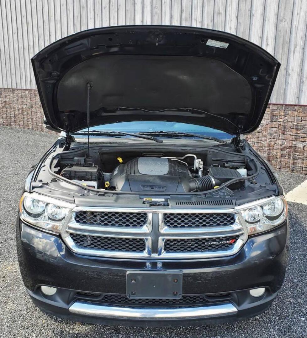 2013 Black Dodge Durango (1C4SDJDT3DC) with an 5.7L V8 5.7L V8 engine, located at 4845 Woodbury Pike, Roaring Springs, PA, (814) 317-5008, (814) 317-5008, 40.250935, -78.366959 - 2013 Dodge Durango Crew Hemi AWD 5.7L V8 6-speed Automatic 3rd Row Seating, Leather, Heated Driver/Passenger/Rear Seats, Sunroof, A/C, Keyless Entry, Remote Start, Premium Alpine Stereo with In-Dash Single CD and Sirius XM, Backup Camera, Like New Tires, New Inspection. Vehicle has a new crate engin - Photo#5