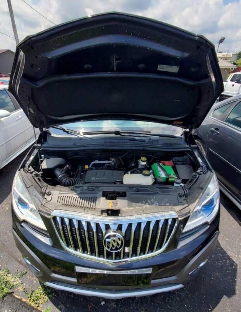 2015 Black Buick Encore (KL4CJHSB4FB) with an 1.4L I4 Turbocharger 1.4L I4 engine, located at 4845 Woodbury Pike, Roaring Springs, PA, (814) 317-5008, (814) 317-5008, 40.250935, -78.366959 - 2015 Buick Encore Premium, AWD, leather, roof, power windows/locks/seats and mirrors, rain sensing windshield, park assist, hands free phone, cruise/tilt wheel and much more. Clean! Ready to go with new inspection! Will come with a 3 mo./3,000-mile warranty, with the option to upgrade. If you have a - Photo#4