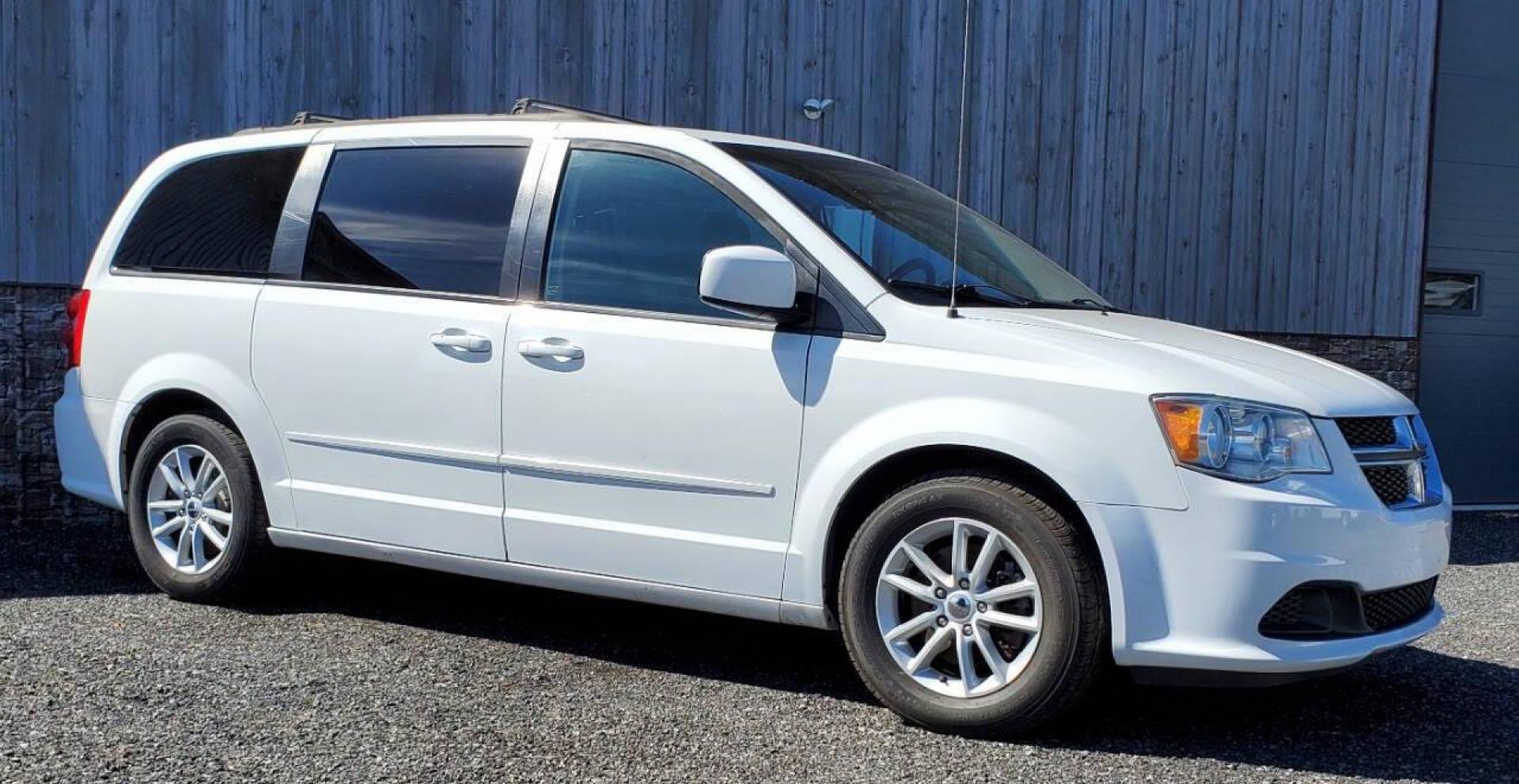2015 White Dodge Grand Caravan (2C4RDGCG4FR) with an 3.6L V6 3.6L V6 engine, located at 4845 Woodbury Pike, Roaring Springs, PA, (814) 317-5008, (814) 317-5008, 40.250935, -78.366959 - 2015 Dodge Grand Caravan SXT 3.6L V6 Automatic 149k Miles FWD Third Row Seating This van is loaded! Sirius Radio with Single Disc CD Player, Bluetooth, DVD Player with Remote, Rear Folding Seats, Back-up Camera, Power Liftgate. Priced low because it has an R-Title due to a cracked bumper and dent in - Photo#1