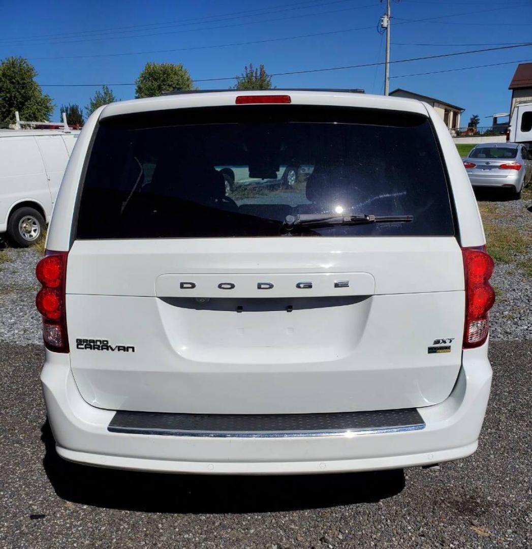 2015 White Dodge Grand Caravan (2C4RDGCG4FR) with an 3.6L V6 3.6L V6 engine, located at 4845 Woodbury Pike, Roaring Springs, PA, (814) 317-5008, (814) 317-5008, 40.250935, -78.366959 - 2015 Dodge Grand Caravan SXT 3.6L V6 Automatic 149k Miles FWD Third Row Seating This van is loaded! Sirius Radio with Single Disc CD Player, Bluetooth, DVD Player with Remote, Rear Folding Seats, Back-up Camera, Power Liftgate. Priced low because it has an R-Title due to a cracked bumper and dent in - Photo#2