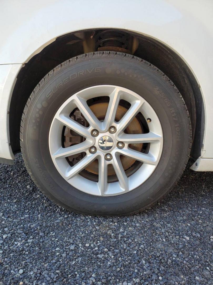 2015 White Dodge Grand Caravan (2C4RDGCG4FR) with an 3.6L V6 3.6L V6 engine, located at 4845 Woodbury Pike, Roaring Springs, PA, (814) 317-5008, (814) 317-5008, 40.250935, -78.366959 - 2015 Dodge Grand Caravan SXT 3.6L V6 Automatic 149k Miles FWD Third Row Seating This van is loaded! Sirius Radio with Single Disc CD Player, Bluetooth, DVD Player with Remote, Rear Folding Seats, Back-up Camera, Power Liftgate. Priced low because it has an R-Title due to a cracked bumper and dent in - Photo#6
