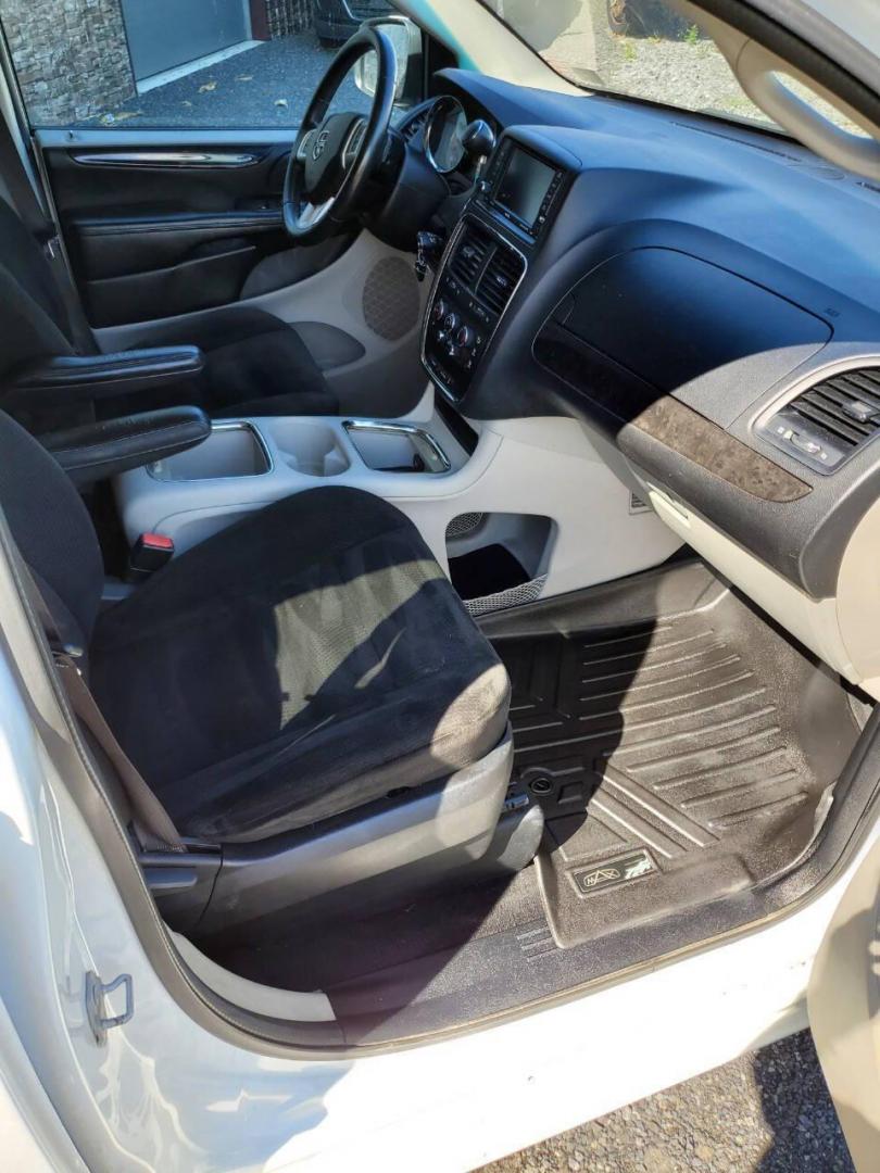 2015 White Dodge Grand Caravan (2C4RDGCG4FR) with an 3.6L V6 3.6L V6 engine, located at 4845 Woodbury Pike, Roaring Springs, PA, (814) 317-5008, (814) 317-5008, 40.250935, -78.366959 - 2015 Dodge Grand Caravan SXT 3.6L V6 Automatic 149k Miles FWD Third Row Seating This van is loaded! Sirius Radio with Single Disc CD Player, Bluetooth, DVD Player with Remote, Rear Folding Seats, Back-up Camera, Power Liftgate. Priced low because it has an R-Title due to a cracked bumper and dent in - Photo#12