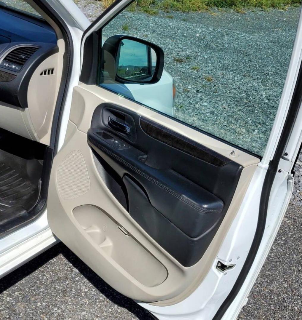 2015 White Dodge Grand Caravan (2C4RDGCG4FR) with an 3.6L V6 3.6L V6 engine, located at 4845 Woodbury Pike, Roaring Springs, PA, (814) 317-5008, (814) 317-5008, 40.250935, -78.366959 - 2015 Dodge Grand Caravan SXT 3.6L V6 Automatic 149k Miles FWD Third Row Seating This van is loaded! Sirius Radio with Single Disc CD Player, Bluetooth, DVD Player with Remote, Rear Folding Seats, Back-up Camera, Power Liftgate. Priced low because it has an R-Title due to a cracked bumper and dent in - Photo#13