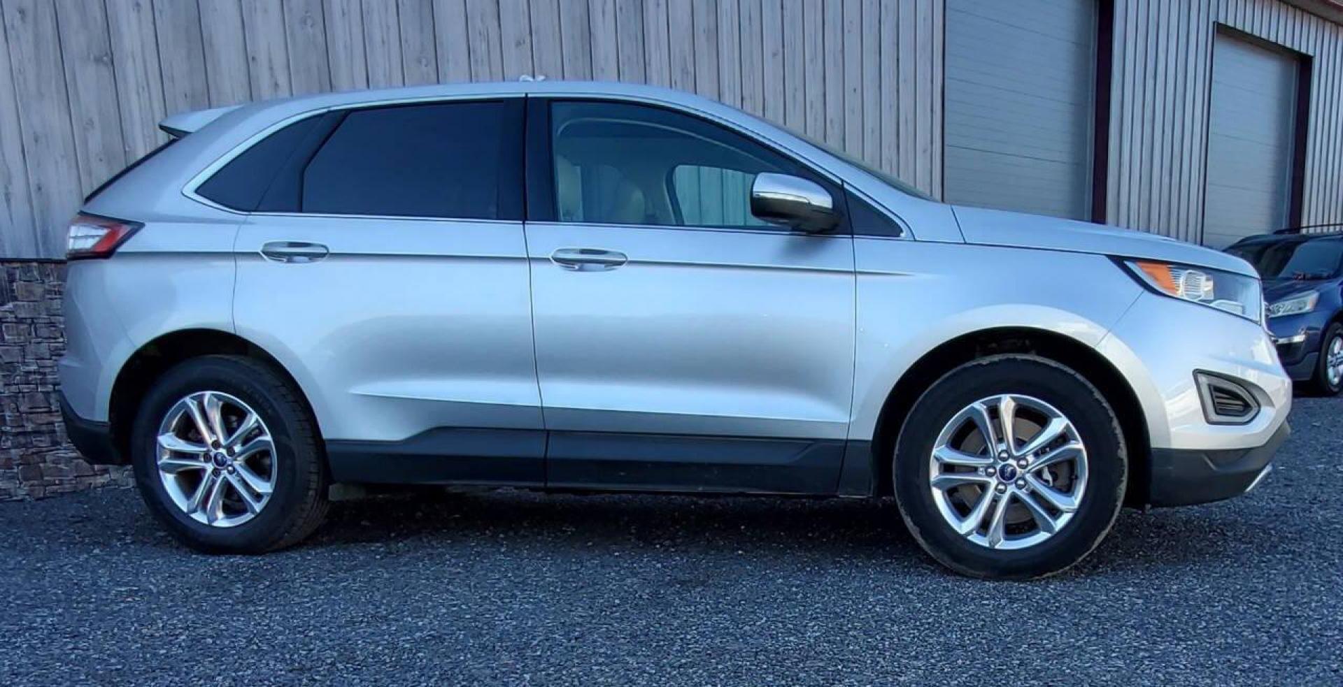 2015 Silver Ford Edge (2FMTK4J90FB) with an 2.0L I4 Turbocharger 2.0L I4 engine, located at 4845 Woodbury Pike, Roaring Springs, PA, (814) 317-5008, (814) 317-5008, 40.250935, -78.366959 - 2015 Ford Edge SEL AWD 4 dr Crossover 2.0L I4 Turbocharger 171k miles Fully serviced and ready to go! New brakes and rotors all around. Leather, Sirius XM, Single CD Player, Bluetooth, Back-up Camera, Heated Seats, Heated Side Mirrors, Moon Roof. Selling so cheap because it has an R-Title due to a h - Photo#1
