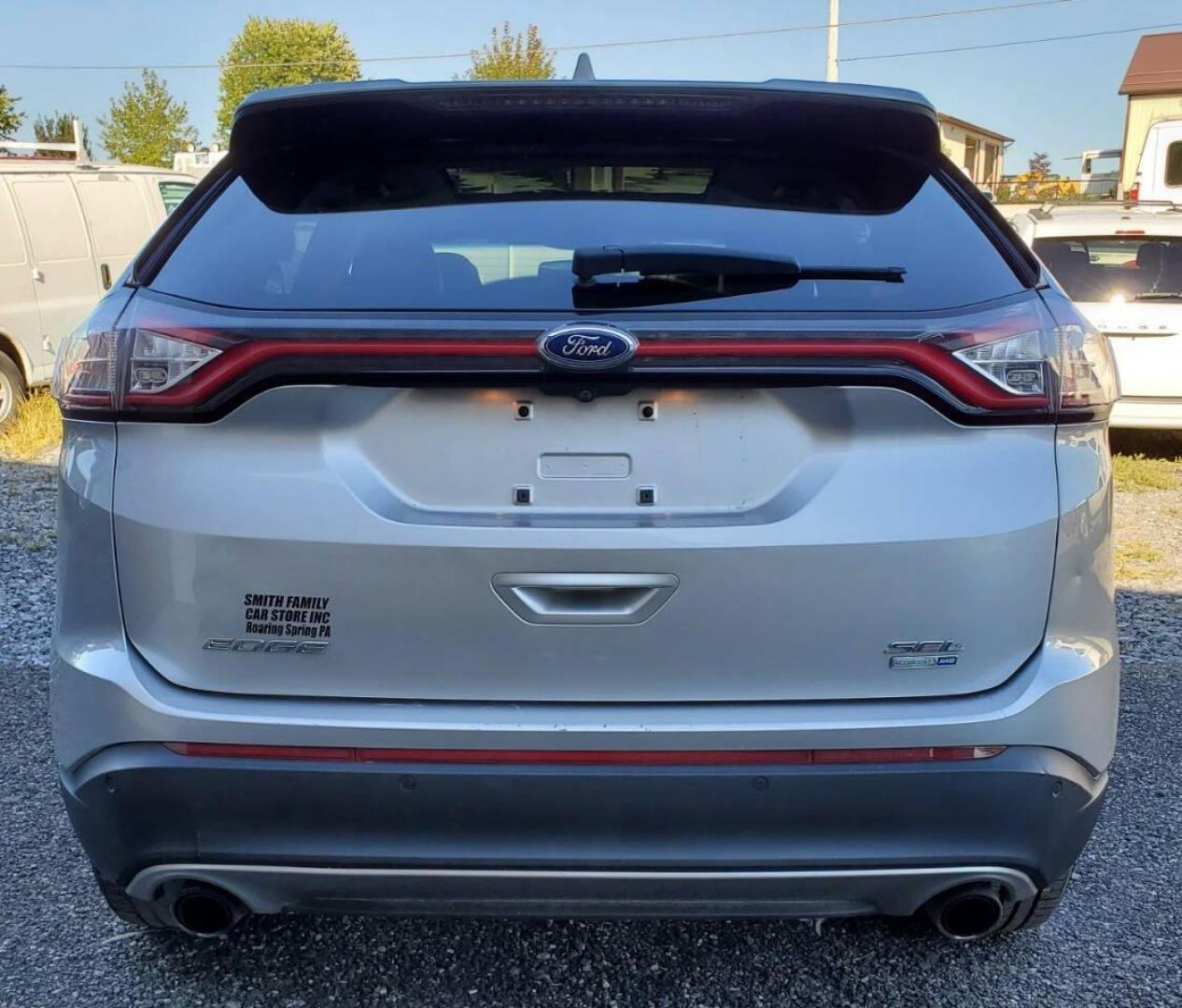 2015 Silver Ford Edge (2FMTK4J90FB) with an 2.0L I4 Turbocharger 2.0L I4 engine, located at 4845 Woodbury Pike, Roaring Springs, PA, (814) 317-5008, (814) 317-5008, 40.250935, -78.366959 - 2015 Ford Edge SEL AWD 4 dr Crossover 2.0L I4 Turbocharger 171k miles Fully serviced and ready to go! New brakes and rotors all around. Leather, Sirius XM, Single CD Player, Bluetooth, Back-up Camera, Heated Seats, Heated Side Mirrors, Moon Roof. Selling so cheap because it has an R-Title due to a h - Photo#2