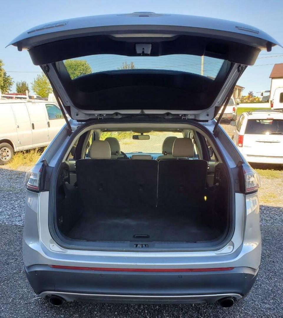 2015 Silver Ford Edge (2FMTK4J90FB) with an 2.0L I4 Turbocharger 2.0L I4 engine, located at 4845 Woodbury Pike, Roaring Springs, PA, (814) 317-5008, (814) 317-5008, 40.250935, -78.366959 - 2015 Ford Edge SEL AWD 4 dr Crossover 2.0L I4 Turbocharger 171k miles Fully serviced and ready to go! New brakes and rotors all around. Leather, Sirius XM, Single CD Player, Bluetooth, Back-up Camera, Heated Seats, Heated Side Mirrors, Moon Roof. Selling so cheap because it has an R-Title due to a h - Photo#3