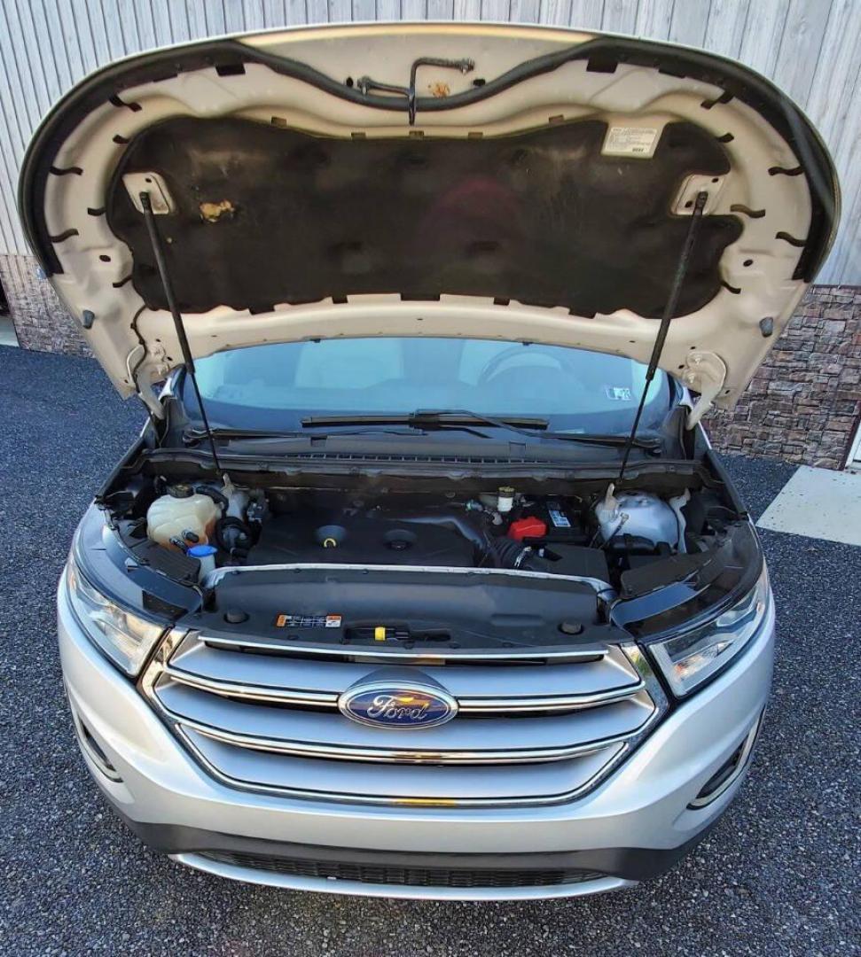 2015 Silver Ford Edge (2FMTK4J90FB) with an 2.0L I4 Turbocharger 2.0L I4 engine, located at 4845 Woodbury Pike, Roaring Springs, PA, (814) 317-5008, (814) 317-5008, 40.250935, -78.366959 - 2015 Ford Edge SEL AWD 4 dr Crossover 2.0L I4 Turbocharger 171k miles Fully serviced and ready to go! New brakes and rotors all around. Leather, Sirius XM, Single CD Player, Bluetooth, Back-up Camera, Heated Seats, Heated Side Mirrors, Moon Roof. Selling so cheap because it has an R-Title due to a h - Photo#5