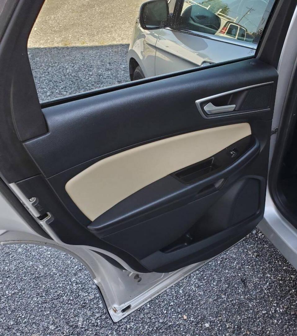 2015 Silver Ford Edge (2FMTK4J90FB) with an 2.0L I4 Turbocharger 2.0L I4 engine, located at 4845 Woodbury Pike, Roaring Springs, PA, (814) 317-5008, (814) 317-5008, 40.250935, -78.366959 - 2015 Ford Edge SEL AWD 4 dr Crossover 2.0L I4 Turbocharger 171k miles Fully serviced and ready to go! New brakes and rotors all around. Leather, Sirius XM, Single CD Player, Bluetooth, Back-up Camera, Heated Seats, Heated Side Mirrors, Moon Roof. Selling so cheap because it has an R-Title due to a h - Photo#12